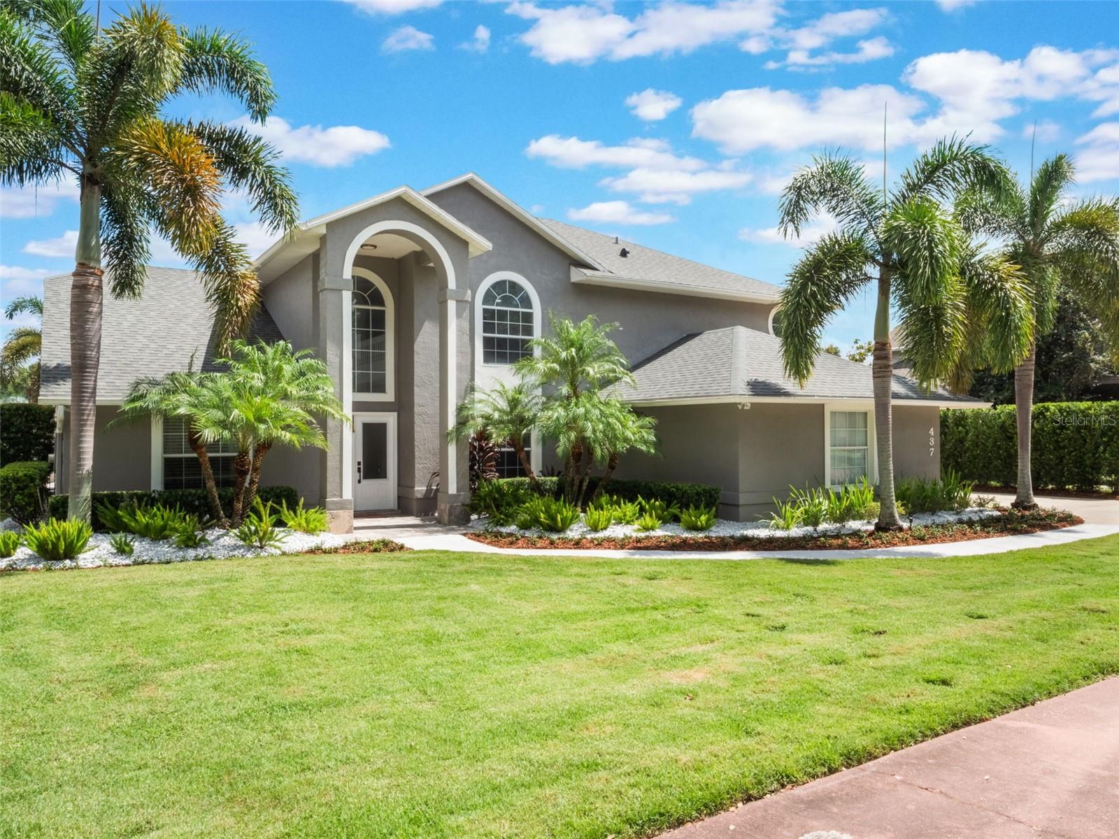 Experience Conway Chain of Lakes living at its finest in this WATERFRONT luxury estate on an oversized lot with over 90 feet of water frontage! The stately curb appeal of this4-bedroom, 2.5-bathroom home sets the tone from the moment you arrive. Step inside and discover architectural elegance paired with modern updates, creating a space that is both luxuries and inviting. This home boasts recent upgrades throughout, including a striking floor-to-ceiling marble tile fireplace, fresh interior paint, completely remodeled bathrooms, new flooring, lush landscaping, and a newly constructed pool and spa designed for resort-style relaxation. The gourmet kitchen is the heart of the home, featuring custom cabinetry, quartz countertops, a center island, and a wine fridge—perfect for both everyday living and entertaining. The expansive family room opens seamlessly to the outdoors, where you’ll find a private oasis complete with a sparkling pool, spa, and a dock with a boat lift, making sunset cruises on the Conway Chain just steps away. The oversized lot offers ample space for gatherings, while the custom outdoor kitchen ensures your home becomes the go-to destination for friends and family.
Retreat to the luxurious owner’s suite overlooking the water, complete with direct pool access, an enormous custom walk-in closet, and a spa-inspired bathroom for the ultimate escape. A unique feature of this home is the secret bookshelf door, which leads to a private hidden retreat, which could be used as an office, or creative space. Highly energy-efficient with a newer roof and AC, this property delivers both comfort and peace of mind. And for families, it’s just down the street from Cornerstone Charter School, blending convenience with top-tier education. Located near I-4 and only minutes to Downtown Orlando, the Orlando International Airport, theme parks, and world-class beaches, this home offers the perfect balance of luxury, lifestyle, and location. Start living the lake life today—schedule your private showing and see why this is more than a home, it’s an experience!
