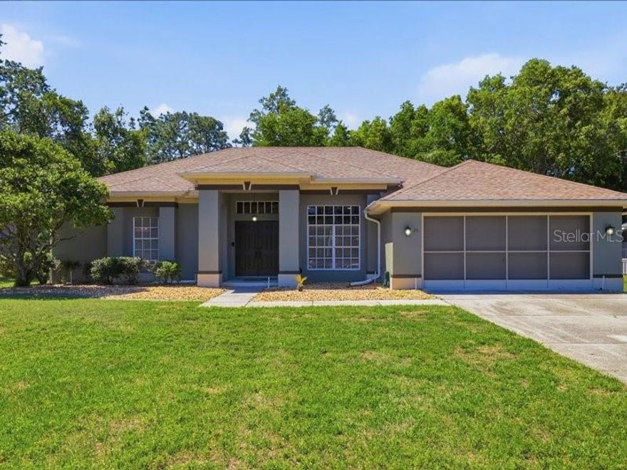 Into the great wide open—where style, sunshine, and effortless living come together. Welcome to this beautifully reimagined home in the heart of Sugarmill Woods, designed for those who appreciate clean lines, modern upgrades, and a space that feels as good as it looks. Located at 35 Cypress Blvd E, this move-in ready residence delivers peace of mind with major updates already done. A newer roof (2022) and AC system (2013) set the foundation, while fresh interior and exterior paint create a bright, on-trend aesthetic from the moment you arrive. Inside, the vibe is fresh and elevated. New flooring flows throughout the entire home, paired with tasteful cabinetry and sleek granite countertops that tie every space together. The updated kitchen is a standout—featuring a stainless steel appliance package, modern finishes, and a layout built for everything from casual mornings to hosting friends on the weekend. Nothing in this home has been overlooked—every inch has been thoughtfully designed to deliver a cohesive, stylish living experience. The owner’s suite brings serious retreat energy, with a beautifully bath that includes a soaking tub and separate shower—ideal for unwinding at the end of the day. The second bathroom has been completely renovated as well, showcasing a new walk-in shower with clean, contemporary finishes. Out back is where this home really shines. An expansive, fully screened lanai with gorgeous pavers sets the scene for laid-back outdoor living, while the brand-new saltwater pool (2024) creates your own private resort -- perfect for pool days, evening cocktails, and everything in between. This isn’t just a home—it’s a lifestyle. Modern, move-in ready, and designed for living well.