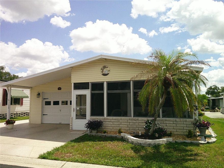 Welcome to Timber Lake Estates! An all aged Gated Community! This Beautiful split floor plan updated home with garage and room to park three cars is waiting for you. Some of the features include an updated Kitchen with quartz counter top's, Recessed lighting and large stainless steel farm sink. Master Bathroom was remodeled with an oversized shower with seat, Glass Doors and rainfall Shower Head, Updated cabinetry with quartz counter tops. The Guest Bath was remolded as well. Luxury Vinyl flooring throughout. Master Bedroom is carpeted and has a large walk-in closet. Windows are updated as well with Thermopane windows. A front and rear Lanai with sliding windows will help you relax. This home is in a great location with easy access to Wesley Chapel and Zephyrhills. All this and located in a very desirable all aged well kept family oriented community with tons of activities and great amenities some of which include 2 pools, 2 clubhouses, Shuffleboard and Basketball courts, fishing lake with dock and YOU OWN THE LAND.
