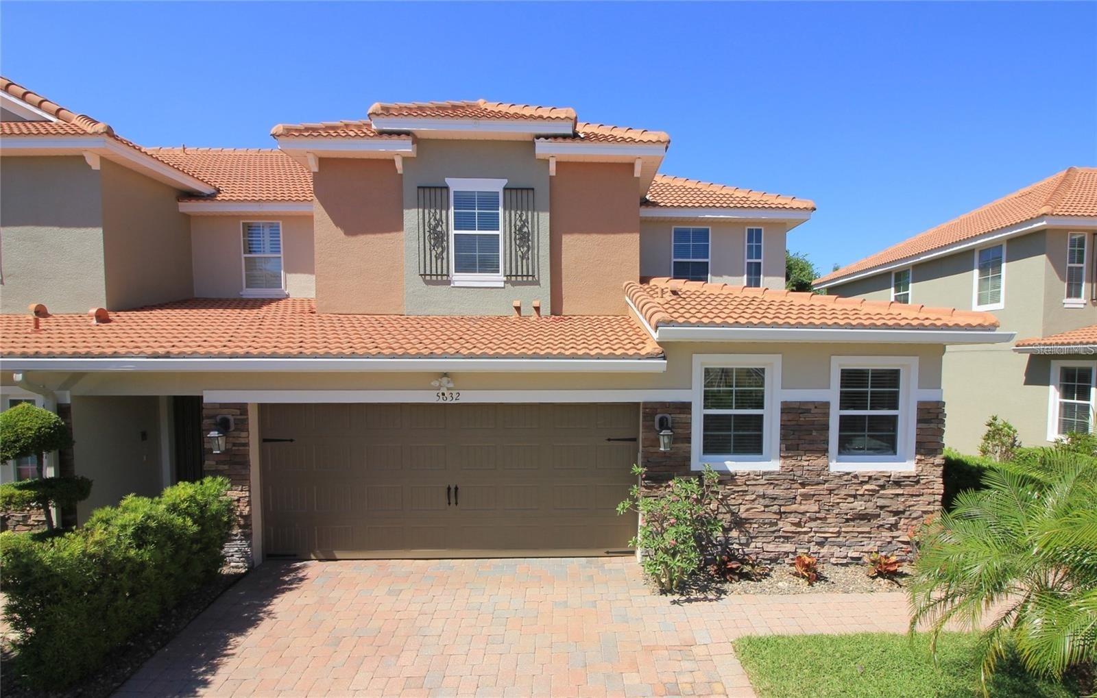 Schedule an appointment to see this pristine and freshly painted townhome in Terracina at Lake Forest, offering the perfect blend of entertaining space and relaxing retreats. The Venice floor plan features 4 bedrooms and 2.5 bathrooms, with upgraded dark brown cabinets, granite countertops, and custom tile backsplash in the kitchen. A breakfast bar separates the kitchen from the dining area, creating an ideal space for casual meals or entertaining. The lower level boasts porcelain tile flooring, crown molding, recessed lighting, ceiling fans, and an oversized covered back patio—perfect for hosting friends or unwinding after a long day. Cooking is a delight with the open kitchen, featuring 42" contemporary cabinets with undermount lighting and trim, upgraded granite countertops, a walk-in pantry with custom built-in shelving, and stainless steel GE Cafe appliances. The main floor master suite includes a large custom-built walk-in closet and a spacious master bathroom with dual sinks, a mirrored vanity, a garden tub, and a separate shower. Upstairs, an open loft overlooks the main level and can be used as an office or small TV area. Three secondary bedrooms are ample size and share a full bathroom with granite countertops a walk-in shower. Through the living room’s sliding doors, enjoy year-round outdoor living on the 20x30 ft screened lanai, large enough for dining and additional seating. Terracina homes are known for the largest patios around, with barrel tile roofs and brick paver driveways adding a touch of elegance. Relax on the front porch and chat with neighbors while enjoying the beautifully landscaped surroundings. Plus, you’re just a short walk away from the community pool and clubhouse, making it easy to take full advantage of all Terracina's amenities. Whether you’re entertaining in the gourmet kitchen or sipping wine on the patio, this home offers the best of both worlds.