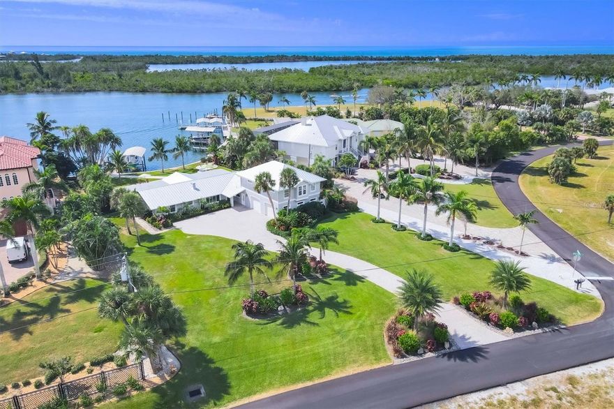 LUXURY ICW ESTATE WITH UNRIVALED BOATING

Live the ultimate Florida waterfront lifestyle from this meticulously renovated 5-bedroom, 3.5-bath retreat located directly on the Intracoastal Waterway (ICW). A boater's dream, this home provides deep water access with no bridges to the Gulf - you can be fishing in the famous Boca Grande Pass or cruising to barrier islands in minutes!

The home is set back on a lush, three-quarter acre lot in the prestigious Cape Haze community. A long paver driveway delivers complete privacy and opens to an expansive lanai and pool deck featuring travertine tiling, a firepit, and nothing but panoramic water views. The pebble-tec pool boasts a heater/chiller for year-round enjoyment.
Boating Infrastructure is Top-Tier: Includes two deep water docks and two upgraded 12,000 lb boat lifts with new motors, aluminum bunks, and durable Trex decking. All docks and seawall caps are newly updated. A cleaning station is adjacent to the slips to prepare the days catch!

Enjoy incredible water views from nearly every room. There is a new 2023 roof, and two newer 2021 air handlers. The kitchen is a chef's delight with granite countertops, stainless steel appliances, a wet bar, and a wine refrigerator.

A thoughtful and private addition was created which is perfect for family or friends. This second floor guest wing features impact-resistant windows, a separate living room, and three vaulted-ceiling bedrooms with a full bath.

Situated on a quiet no-wake zone of the ICW—perfect for kayaking or paddleboarding—this location is minutes from stunning beaches, championship golf, biking paths, and waterfront dining. Offered furnished (with some exclusions) for an immediate transition to your new waterfront life.