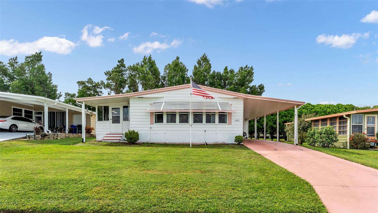 Looking for the perfect blend of space, comfort, and community? Welcome to this well-kept 3 bedroom, 2 bath home in the highly sought-after 55+ Foxwood Lake Estates in Lakeland, Florida, where you OWN the land! Seller is second owner and the home reflects it, sparkling clean and very well cared for with lots of updates! Featuring a spacious open floor plan, the remodeled kitchen shines with solid wood cabinets, pull-out drawers, new vinyl plank flooring and a large breakfast bar overlooking the bright living room with updated bay windows. Primary bedroom is very large and will house your king size bed with ease. Enjoy all the storage with walk-in closets and pamper yourself in the refreshed en suite and 2nd bath. The versatile third bedroom is currently a sewing studio but easily doubles as an office, guest quarters, or think small business space? Thoughtful upgrades include a roof-over (2009), updated electrical panel and water heater (2024), newer water softener, A/C (2016) was just serviced with a new motor and a new vapor barrier (2015). You’ll love the convenience of inside laundry with washer/dryer included, plus a shed with golf cart garage door, workbench, and tons of storage. Low HOA dues give you access to incredible amenities—clubhouse, fitness center, library, billiards, sauna, heated pool, hot tub, pickleball, shuffleboard, bocce, horseshoes, basketball, a scenic walking path around the lake, and more! Partially furnished and move-in ready, this home is the perfect Florida lifestyle package—schedule your private showing today!