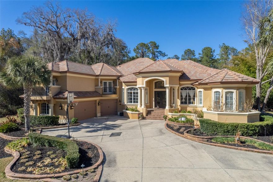 Located within the  gated community of Laurels of Bellechase, complete with 24-hour guarded security, this exceptional residence offers both privacy and peace of mind. Perfectly positioned on a spacious corner lot spanning a full acre, the setting provides room to breathe while creating a stunning backdrop for exquisite living and grand-scale entertaining.

Step inside to a breathtaking foyer where seamless glass doors immediately frame spectacular views of the outdoor pool and entertainment area, setting the tone for the resort-style experience that awaits. The thoughtfully designed split floor plan features four generously sized bedrooms plus a private office, delivering both comfort and functionality for everyday living.

The gourmet kitchen is truly a chef’s dream, showcasing top-of-the-line appliances, custom wood cabinetry, and luxurious granite countertops that inspire culinary creativity. A stylish beverage bar adds an elegant touch while flowing effortlessly into the inviting family room—perfect for hosting gatherings or enjoying relaxed evenings at home. Custom built-ins provide abundant storage, and expansive stackable sliding glass doors open wide to create a seamless transition to the outdoor oasis.

Indoor entertainment continues in the spacious game room, complete with a sleek bar and ample space for a pool table—ideal for lively game nights and unforgettable celebrations. Every detail of this home has been carefully curated to elevate both comfort and entertainment.

Outside, the resort-style retreat is nothing short of extraordinary. With three separate pool entrances, a park-like slide, a soothing hot tub, cascading waterfalls, and a drop-down oversized projector screen for watching your favorite sporting events, this space is designed for year-round enjoyment. The private cabana enhances the experience even further, offering poolside seating, a full bar area, a bath, smart TV, and an impressive 1,700+ bottle wine display—an entertainer’s dream capable of hosting gatherings of any size.

Just a short walk from the main residence, a private one-bedroom, one-bath guest house with its own kitchen provides the perfect space for extended family, guests, or a mother-in-law suite—adding both flexibility and value to the property.

From tranquil evenings under the stars to vibrant celebrations with friends and family, this remarkable residence delivers an unparalleled lifestyle. A virtual tour is available so you can explore every exquisite detail of this extraordinary property.