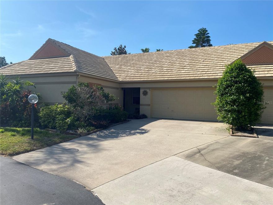 Single story 3 BEDROOM corner villa with a two car garage and a nicely maintained fenced backyard area. In addition to tile floors and vaulted ceilings in the living room and dining room, this villa has an air conditioned Florida room, which makes for a great second family room. Kitchen has a nice size eating space and black/stainless appliances. Master bedroom has nice size walk in closet. May be sold furnished. Great location in quiet cul de sac, with additional guest parking. Gated community with pool and tennis court. Located in the popular Lakebridge community, this home has a private backyard area, an attached two car garage. This pet-friendly community features tennis courts, a clubhouse, and 2 heated pools. Only 12 miles to the gorgeous beaches of Anna Maria Island. Convenient Bradenton location next to IMG Academy & many golf courses and close to Blake Hospital, G.T. Bray Park, the YMCA, medical offices, restaurants, and shopping. A short drive to the Riverwalk, Robinson Preserve, DeSoto National Park and Palma Sola Botanical Gardens, Sarasota, St Armand's Circle, Van Wezel Performing Arts, Asolo Theater and Selby Gardens. Tampa Bay/St Petersburg about 45 minutes away, offers Tropicana Field, Raymond James Stadium, Amelia Arena and Busch Gardens.