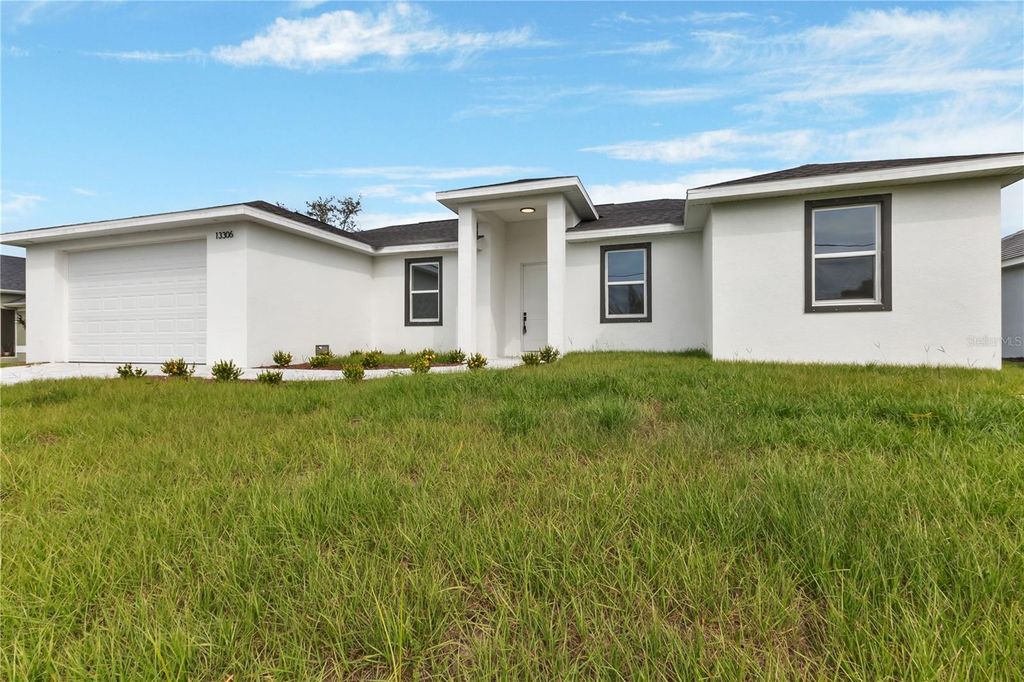 Photo of 13306 Allentown Avenue, Port Charlotte, FL 33981 (MLS # O6358350)