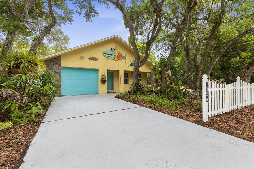Find Your Own Piece of Sunshine in Flagler Beach! 
Fall in love with the laid-back rhythm of coastal living in this move-in-ready ranch. Tucked behind a classic white picket fence, this 2-bedroom, 2-bath gem perfectly captures the artsy, effortless spirit of Flagler. Step through French doors into your private, screened lanai, or head up out to the elevated deck to soak in views of your lush .14-acre retreat. Backing up to the tranquil Conservation creeks and canals of the ICW, privacy is your new neighbor.

Inside, the open-concept kitchen is an entertainer’s dream—perfect for hosting game day or a post-beach brunch. Whether you’re golf-carting to First Friday, hitting the Farmers Market, or walking just blocks to the Atlantic, this is the beach life you’ve been dreaming of. Call today for a private tour!