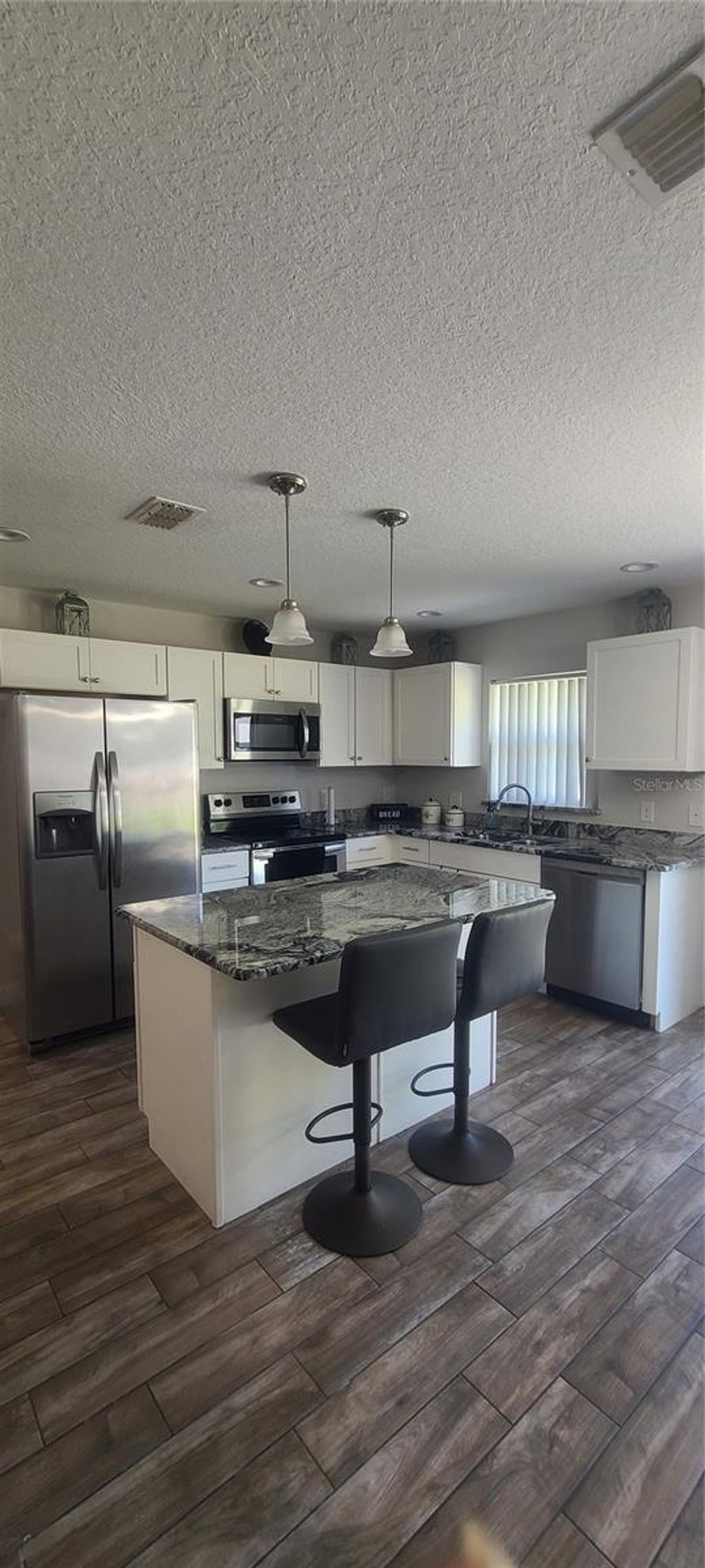 Photo of 401 Robert Avenue, Winter Haven, FL 33880 (MLS # O6362338)