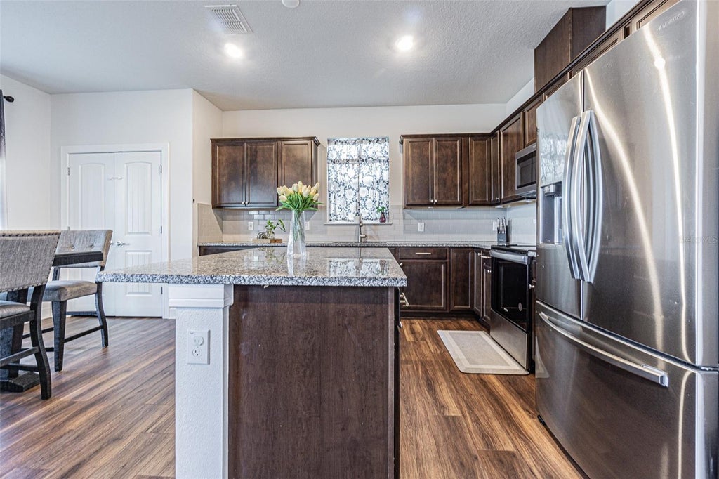 Photo of 21027 Monza Loop, Land O Lakes, FL 34638 (MLS # TB8530661)