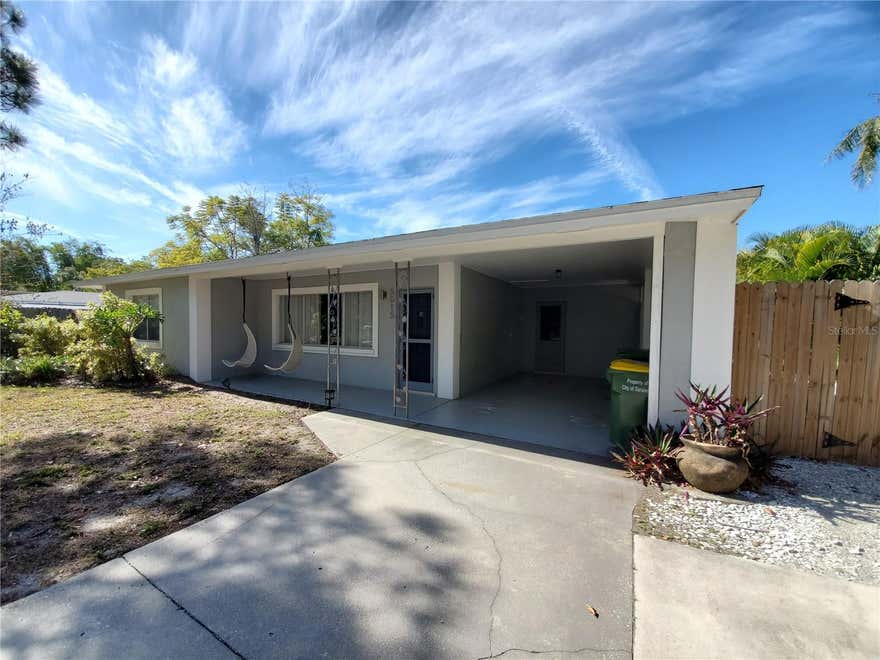 Welcome to this beautifully maintained 3-bedroom, 3-bathroom POOL home located in the highly sought-after Sapphire Shores neighborhood, just west of the trail and steps from the Ringling Museum, Sarasota Bay, and downtown. This bright and spacious residence features timeless terrazzo flooring, expansive new windows that fill the home with natural light, and an updated kitchen complete with granite countertops, stainless steel appliances, and ample cabinet space—perfect for both everyday living and entertaining. The thoughtfully designed layout offers a private primary suite, generous secondary bedrooms, and a versatile bonus space ideal for a home office, den, or flex room. An indoor laundry room adds convenience to your daily routine.

Step outside to your own private oasis—featuring a fully fenced backyard with lush tropical landscaping, a screened-in porch, and a sparkling private pool. Whether you're hosting guests or enjoying a quiet evening at home, this outdoor space is designed for year-round Florida living.