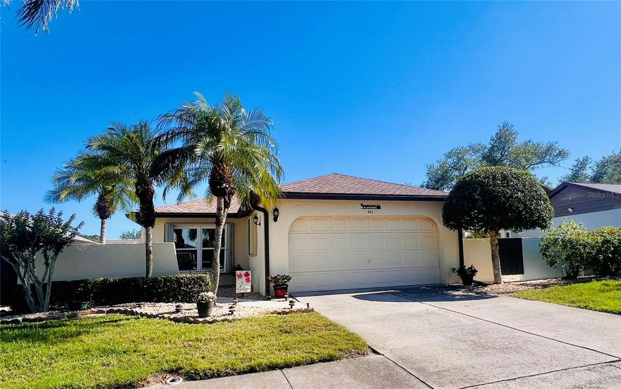 Spacious 2-bedroom, 2-bath freestanding villa located in Foxwood, a 55+ community in Englewood, Florida. Home features a bright & airy Florida room, and kitchen includes granite countertops and ample cabinetry. An oversized living and dining area offers cathedral ceilings, a fireplace, and sliding glass doors that open to a large, tiled patio and a separate private atrium. The primary suite includes a walk-in closet and en-suite bath with an oversized vanity and walk-in shower. Hurricane shutters are installed on all windows and sliders. The home provides lots of interior storage along with a two-car garage, which includes a utility sink. Interior laundry room located just off kitchen. Roof and A/C were replaced in 2023 per Sarasota County permitting. Foxwood offers an active lifestyle with a heated pool, spa, tennis and pickleball courts, bocce, shuffleboard, fitness room, library, and nature trail. Conveniently located near Historic Dearborn Street, local farmers markets, area golf courses, and just minutes to Manasota Key beaches, dining, and outdoor recreation.