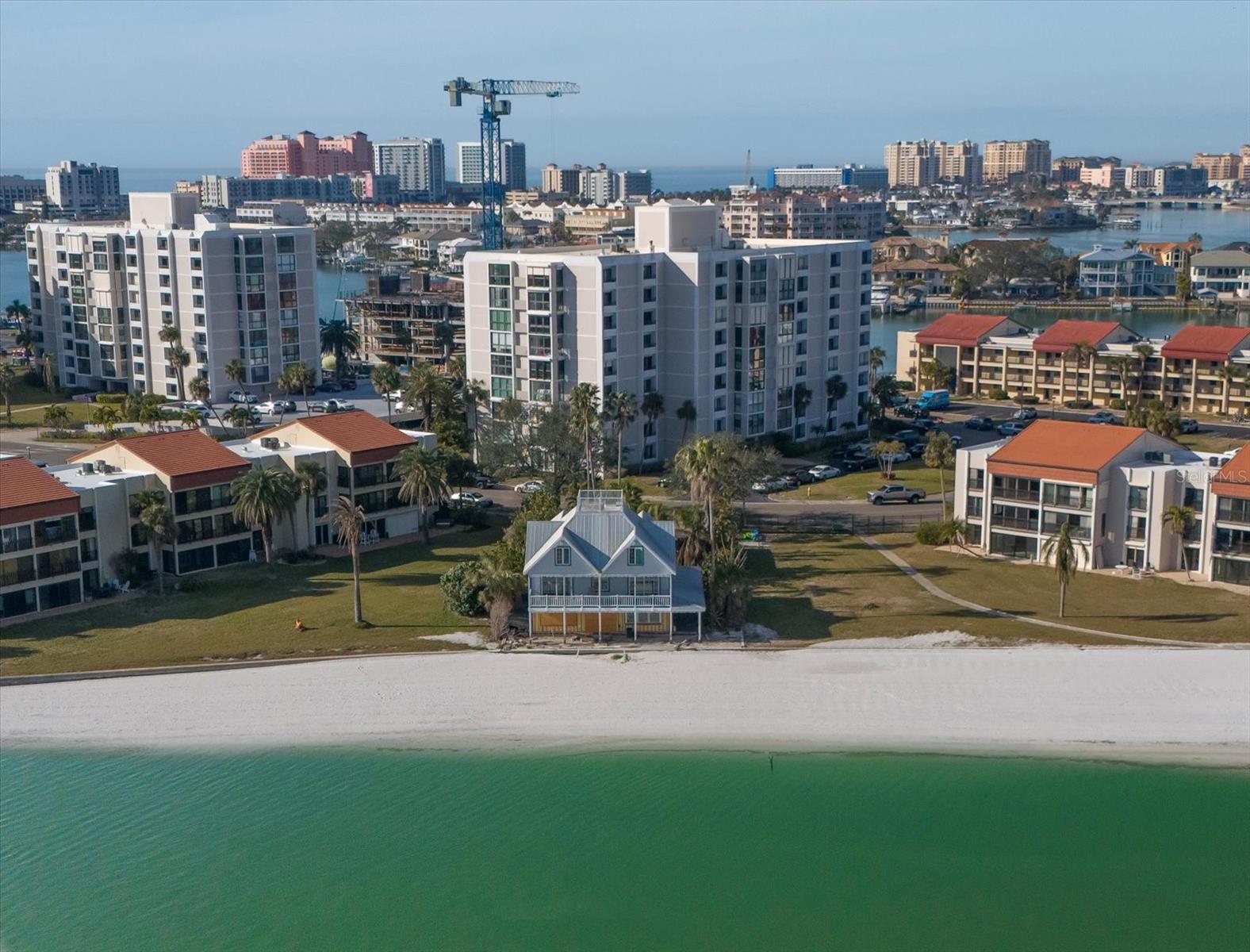 Under contract-accepting backup offers. Seller financing available!! Welcome to 887 S Gulfview, one of the most unique properties in Clearwater Beach. This "holdout" home has stood the test of time while maintaining its charm and character. Prime beachfront property with direct access to pristine white sugar sands of Clearwater Beach. A well-preserved slice of old Florida, offering a rare opportunity to own this beautiful home. Whether you choose to renovate, restore, or re develop, this property presents an unparalleled investment opportunity. This home was damaged on the lower level by hurricane Helene. Schedule your private showing today.