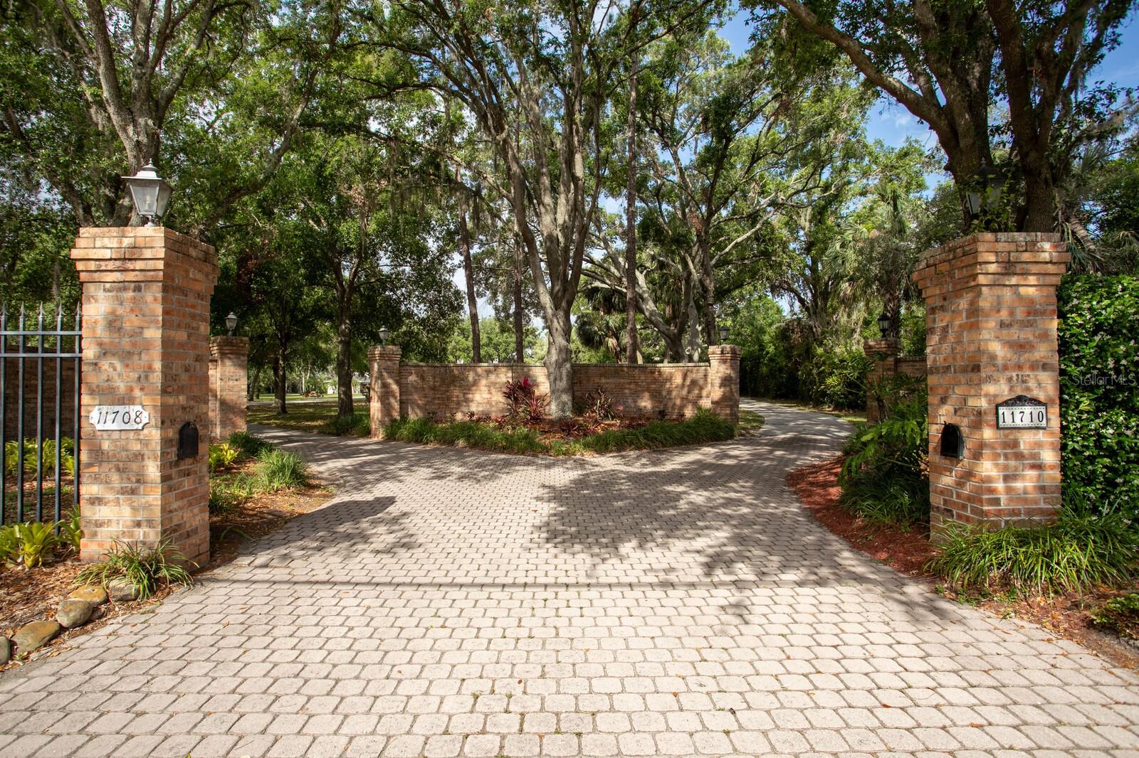 One or more photo(s) has been virtually staged. Elegant Lakeside Estate on Exclusive Lake Carroll! This is a rare opportunity to lease an elegant estate on the exclusive and highly sought-after Lake Carroll. Set on a private, gated property with a sweeping driveway, this beautifully crafted home offers 5,377 SF of living space designed to embrace its breathtaking lakeside setting. With timeless architectural details, soaring ceilings, and tranquil water views, this home blends classic style with thoughtful design, offering a serene retreat just minutes from Tampa's vibrant city life. This 4-bedroom, 4 full and 1 half-baths, study, plus bonus room home also features a spacious 4-car garage and the added convenience of a generator. MAIN LEVEL: As you step inside, the grand two-story foyer greets you with travertine floors featuring granite inlays and an impressive staircase with rich wood steps and wrought iron railings, perfectly blending elegance and craftsmanship. Just off the foyer is a private study with custom built-ins and a conveniently located powder bath, creating a refined space for work or quiet reflection. The expansive great room with 20 foot ceilings is bathed in natural light from its two-story windows that perfectly frame the stunning views of Lake Carroll. A marble fireplace serves as the centerpiece of the room, with an adjacent entertainment area and a thoughtfully designed bar that’s ideal for hosting guests. The dining room, positioned near the great room and hallway, offers an elegant setting for formal gatherings. From there, the kitchen and breakfast nook await, featuring warm wood floors, generous counter space, and serene lake views to inspire your culinary creations. The main level also includes a comfortable guest suite with a private en-suite bath, ensuring privacy and convenience for visitors. Both front and back staircases provide easy access to the upper level, enhancing the flow and functionality of this spacious home. UPSTAIRS FEATURES: The upper level continues to impress with a luxurious primary suite that serves as a private retreat. Enjoy a serene sitting area overlooking the lake, a spa-like en-suite bath, and ample closet space. Two additional bedrooms, each thoughtfully designed, share this level along with a versatile entertainment or media room that’s perfect for movie nights, game days, or relaxation. Lake Carroll Lifestyle: The outdoor spaces are where this property truly shines. A private dock and boatlift provide direct access to Lake Carroll, a pristine 210-acre private lake known for its exclusivity and recreational opportunities. Whether you enjoy boating, fishing, paddle boarding, or simply soaking in the peaceful scenery, life on Lake Carroll offers a rare blend of activity and serenity. The lush grounds surrounding the home offer ample space to create your own backyard oasis, perfectly complementing this stunning lakeside property. Located in the heart of Tampa’s Carrollwood area, this home offers convenient access to top-rated schools, upscale shopping, fine dining, and close proximity to the airport and highways, along with all the amenities that make Tampa such a desirable place to live. Don’t miss your chance to experience this exceptional home and the coveted lifestyle of Lake Carroll. Schedule your private tour today to see it for yourself! Also listed for purchase, MLS Number: TB8337101