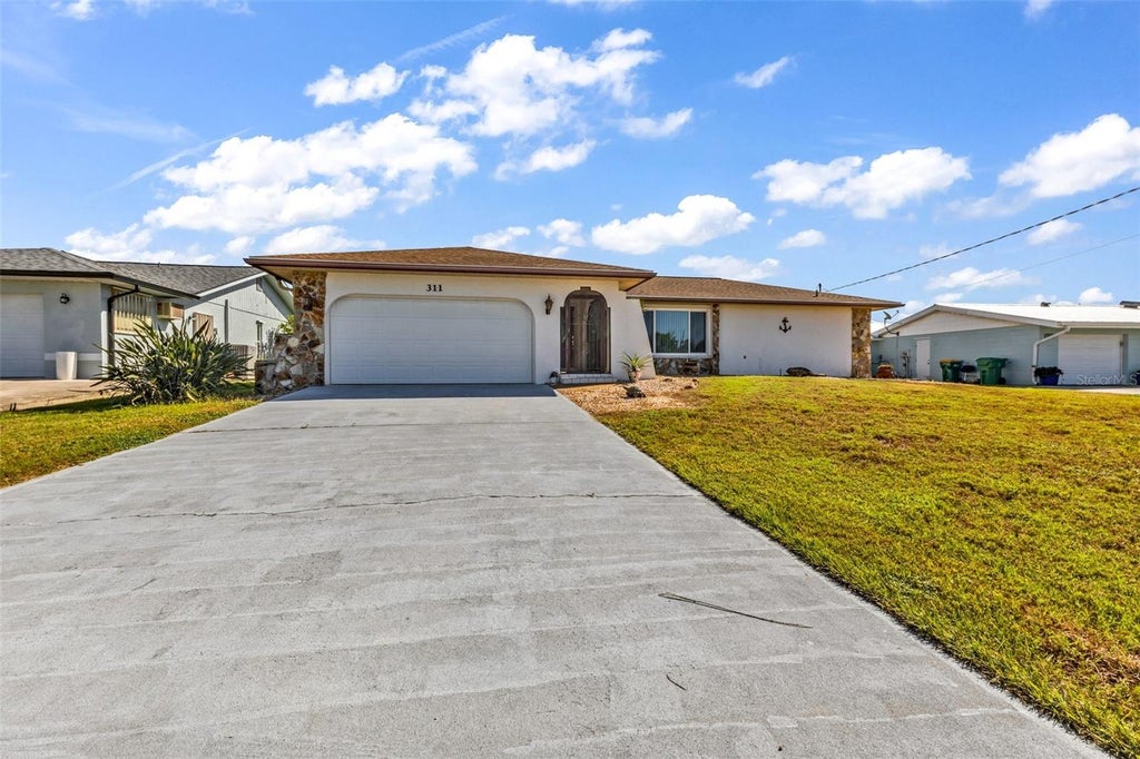 Photo of 311 W Tarpon Boulevard NW, Port Charlotte, FL 33952 (MLS # C7532363)