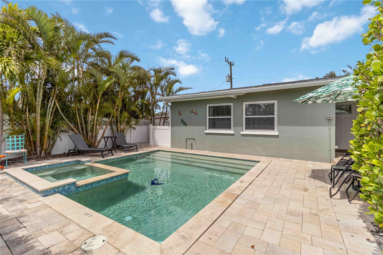 This beautifully restored, income producing property can be yours! Welcome to Island Delight on Anna Maria Island. Offered TURNKEY furnished with an active rental history and brand new roof, this property provides flexible options to enjoy paradise. Primely located just a few blocks from the turquoise waters and powdery sand of the Gulf, you can enjoy the the island's serene beauty whenever you wish. You'll love the private, heated, saltwater pool and spa as you walk through the gates of this charming home--adorned with beautiful pavers. Inside you'll find an inviting space with a large kitchen equipped with all new stainless steel appliances, kitchen cabinetry and fixtures. The granite countertops are a nice touch with bar seating at the peninsula. The bathroom is conveniently positioned between the two spacious bedrooms. The living space boasts an open concept to the spacious dining area, and an exterior door that leads out to your secluded and fenced deck area. The grand back yard space/deck is equipped with a sitting area, grilling space, outdoor shower and adorable shed for all your beach gear. The parking pad is large enough for two vehicles which makes parking on the island seamless! The community of Seaside Gardens has a low monthly HOA fee that includes water which makes owning a pool very cost effective. Even more, you have access to tennis courts, pickleball courts, shuffleboard, basketball court and a playground! With its unbeatable location and income potential, this property is an exceptional investment opportunity.