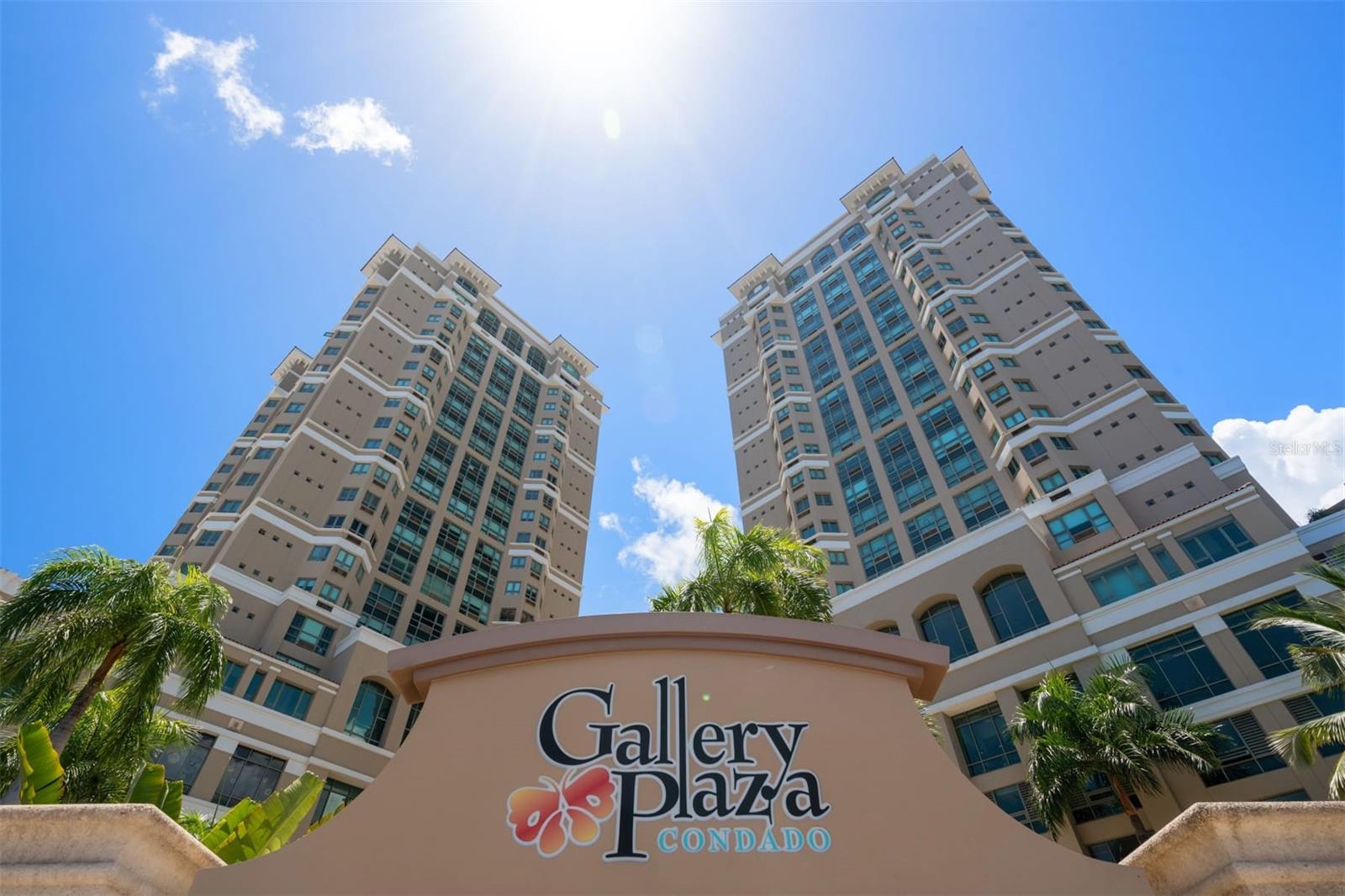 Refined Living in the Heart of Condado
This beautifully remodeled 2BR/2BA residence at Gallery Plaza offers 1,377 sq ft of refined living, perfectly reimagined to enhance comfort, flow, and enjoyment. From the moment you step inside, sweeping city and ocean views set the tone for a space that is as inviting as it is impressive.
The open-concept layout is anchored by a gourmet kitchen with GE Monogram appliances, custom cabinetry, and designer lighting—ideal for both everyday living and effortless entertaining. The master suite boasts an en-suite bathroom and generous closet space, including a walk-in closet. The guest bedroom features a custom-built Murphy bed and two desks that can be conveniently opened or closed to maximize space as needed. The masterfully redesigned bathrooms feature custom vanities, premium fixtures, and elegant finishes, while both bedrooms offer custom closets and bespoke details.
Every upgrade, from new large-format flooring and electric shades to multiple inverter A/C units and a fully equipped laundry room, reflects a commitment to quality and style.
Gallery Plaza residents enjoy resort-style amenities including concierge service, pool, and fitness center, all within steps of the beach, fine dining, and Condado’s vibrant lifestyle.