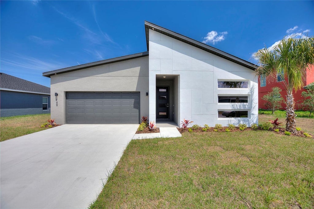 Photo of 149 Golf Aire Boulevard, Haines City, FL 33844 (MLS # O6436230)