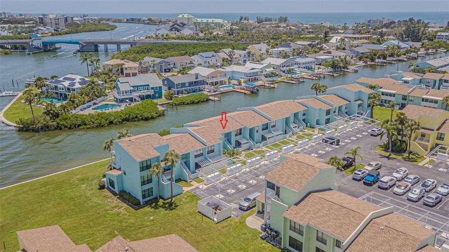 Want a dream coastal getaway in Indian Rocks Beach, just blocks away from the Gulf?  This IS it!  Fully furnished, TURNKEY, Waterfront condo offers the best of Florida living.  This bright and spacious condo is bigger than it looks and offers breathtaking views of the Intracoastal Waterway from the primary bedroom, extended great room, kitchen, and bonus room.   Relax in Casual elegance in this updated 2-bedroom, 1-bath condo, ready for you to move right in!  Covered front porch welcomes you to enter thru Double entry doors into the foyer to find a tiled entry and a spacious utility closet. Large windows brings the beauty of the outdoors in and you will be impressed with the casual décor and loads of storage.  Large windows and custom mirror insets bring in natural light and reflects the peaceful, natural water views throughout the home, making the interior feel bright, airy, and serene.  The condo features thoughtful upgrades including durable laminate floors, tile in the entry and bathroom, plus a recently renovated kitchen with white cabinets, granite look countertops and a sleek matte black sink.  The layout includes a cozy dining area with a freestanding electric fireplace, eat-in breakfast nook with built-in bar and bookshelves in the bonus room that can be used as an office, guest space, or reading nook... all while enjoying shimmering water views of the canal with natural Florida Landscape.  You’ll also love the convenience of the in-unit laundry area with energy-efficient washer and dryer, plus recent updates like a newer water heater and roof aid in energy efficiency.  The community offers amenities that make every day feel like a vacation, including a pool, clubhouse, and shuffleboard courts overlooking the Intracoastal.  Whether you're looking for a full-time residence, vacation home, or investment opportunity, this condo delivers relaxed Florida living for lounging indoors or enjoying the coastal breeze outside on the covered front porch.  Close proximity to  charming cafes, specialty shops and the small town of Indian Rocks Beach, nestled between famous Clearwater and St Pete!  Come fall in love with the easy, waterfront lifestyle you've been dreaming of... CALL TODAY!