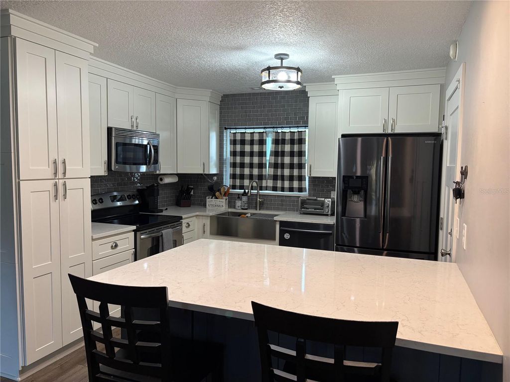 Photo of 10010 Gannon Lane, Orlando, FL 32821 (MLS # O6409698)