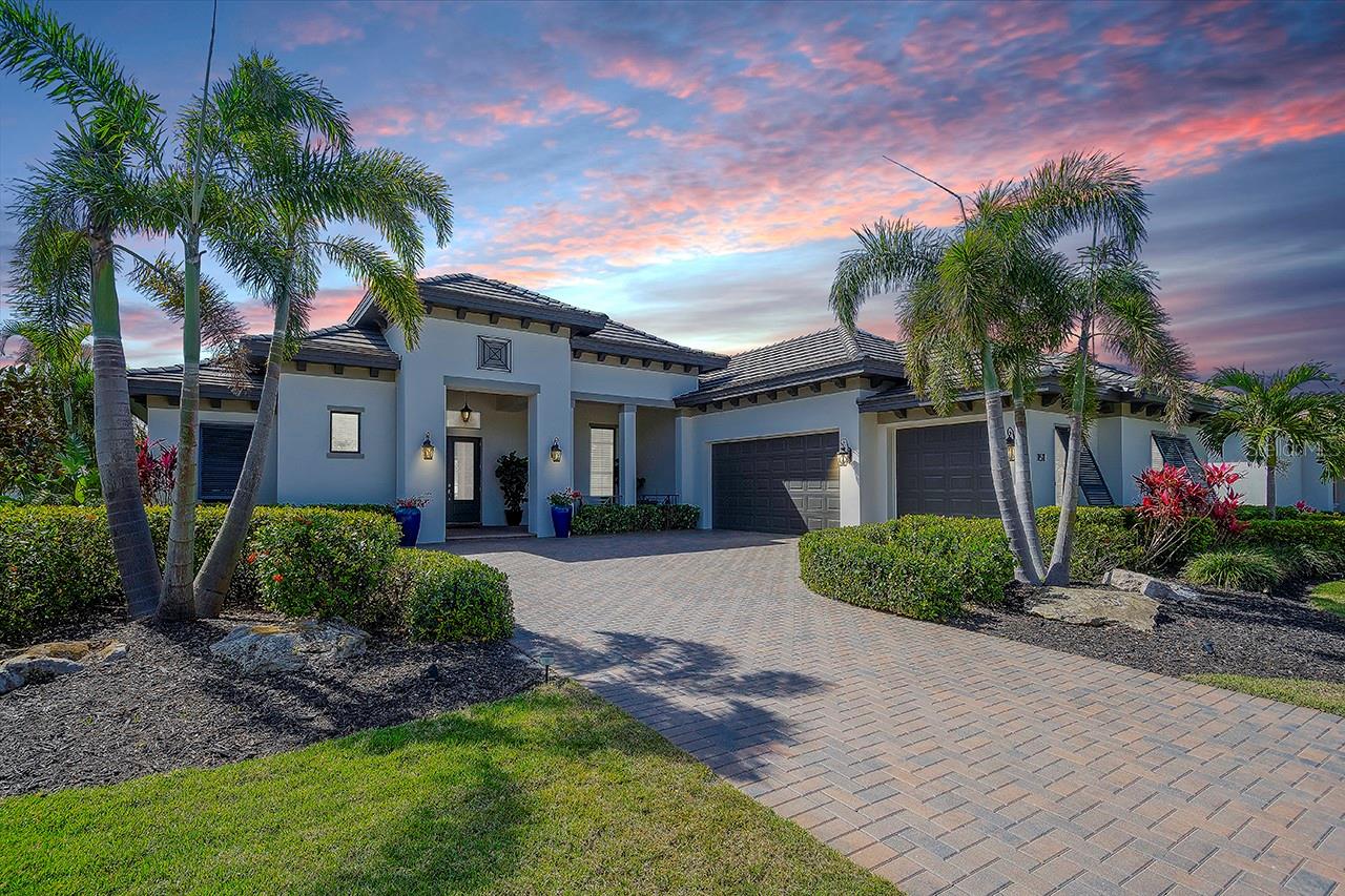 Experience Elevated Waterfront Living in Timeless West Indies Elegance
Welcome to a rare offering in the Islands on the Manatee, where luxury, lifestyle, and location converge. This exquisite custom Arthur Rutenberg Home is your gateway to refined coastal living, featuring direct boating access to the Manatee River, Tampa Bay, and the Gulf of Mexico--right from your private dock complete with a 10,000 lb. boat lift, water and power.
Perfectly situated on nearly half an acre within one of the area's most sought after gated communities, this residence offers privacy, tranquility, and seamless access to nature and the open water-- an unmatched combination in today's market.
From the moment you enter the grand foyer, you are welcomed into an expansive open-concept great room and chef-inspired gourmet kitchen, where indoor and outdoor living blend effortlessly. Massive sliding glass doors open to a beautiful screened lanai showcasing a saltwater pool with in-water firepit, fountains, travertine pavers, and a fully equipped outdoor kitchen featuring a stainless steel gas grill, dual burners, hood, sink, and beverage fridge-- designed for unforgettable entertaining.
Inside, you will find nearly 3000 square feet of refined single-level living, highlighted by soaring ceilings, elegant double crown molding, neutral tile and wood flooring, impact-rated windows and doors, and plantation shutters. the split-bedroom floor plan includes three spacious bedrooms, three full baths, and a dedicated home office or optional fourth bedroom, offering flexibility for families and guests.
The gourmet kitchen features an oversized island with seating and storage, natural granite countertops, Café stainless steel appliances, a wine fridge, and induction cooktop--delighting the most discerning chefs. The great room is anchored by a stepped tray ceiling, recessed lighting, and a stunning tone accent wall--creating a warm and inviting space to relax and unwind.
Retreat to your expansive primary suite, featuring a luxuriously appointed dual shower, custom cabinetry, and an oversized walk-in closet. Additional features include a three and a half car garage with golf cart space, high ceilings and timeless architectural detailing throughout.
Enjoy an array of lifestyle amenities with optional membership to The Club at River Wilderness, including a championship 18 hole golf course, lighted tennis and pickleball courts a full service athletic center and a vibrant social scene. Residents also have access to The River Lodge Clubhouse, including a fitness center, putting green, and 24 hour security for ultimate peace of mind.
Just 3 miles from Lakewood Ranch, this location offers the perfect blend of exclusivity and convenience, with close proximity to dining, shopping, healthcare, and culture--while embracing the true boater's lifestyle that only this waterfront setting can provide.
With NO CDD fees, a low HOA, an one of the finest the waterfront lots in the region, this is more than a home-- it is a rare opportunity to live an exceptional lifestyle every day.
Schedule your private tour today and discover the art of fine coastal living. BRAND NEW HVAC SYSTEM INSTALLED JUNE 4 2025. 10 YEAR WARRANTY!!!