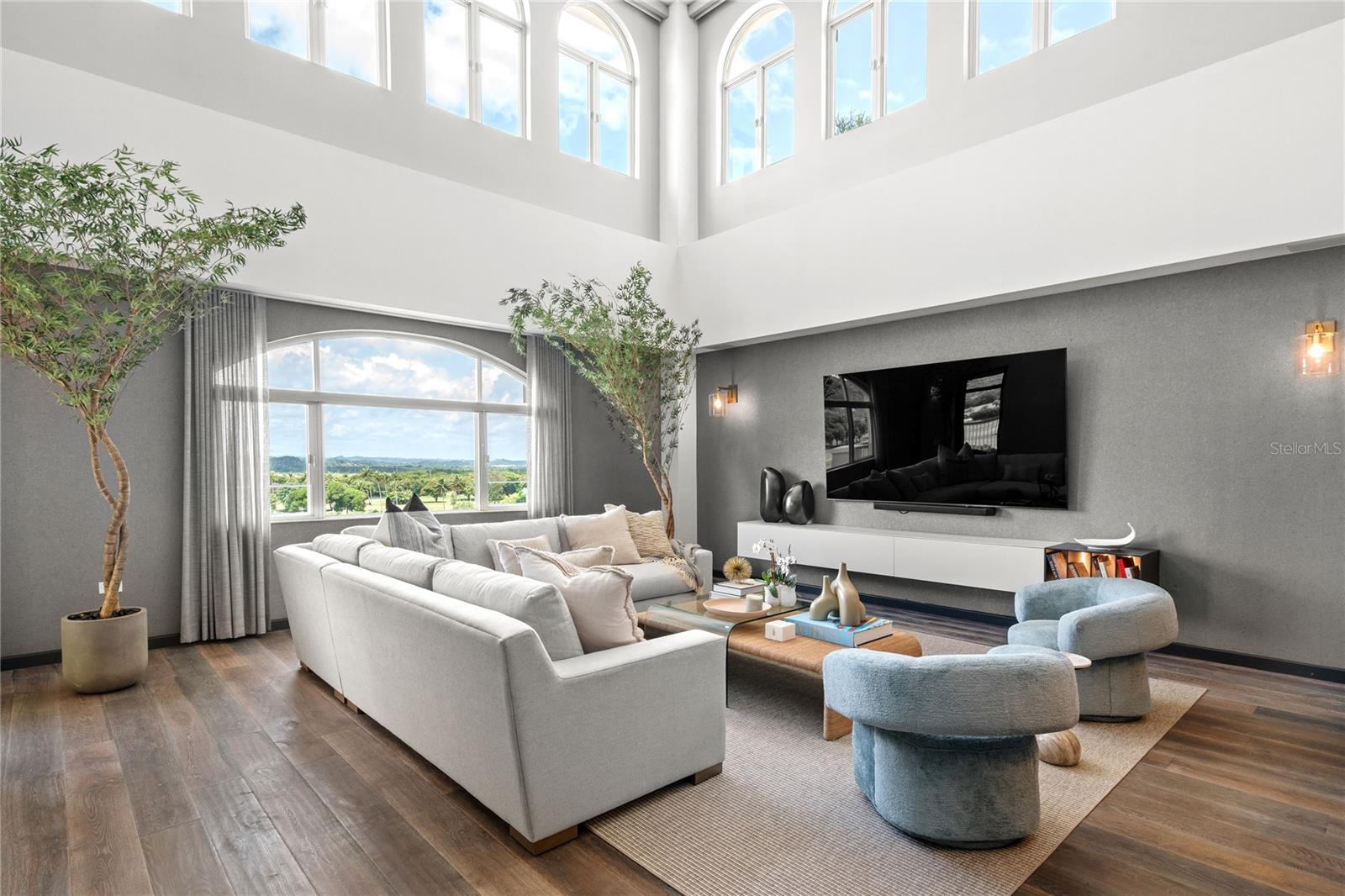 Introducing The Penthouse at Plantation Village, a stunning two-story residence located on the golf course within the exclusive gated community of the Ritz Carlton Reserve at Dorado Beach. Spanning an impressive 7,310 square feet, this luxurious home effortlessly combines 4,810 square feet of meticulously crafted interiors with a sprawling 2,500 square foot private rooftop terrace, offering breathtaking views of the expansive golf course and majestic mountains.
Upon entering the living spaces, be captivated by the grandeur of double-height ceilings in the expansive living room creating an atmosphere of elegance and spaciousness. The open floor plan harmoniously blends the living, dining, and kitchen spaces, which are adorned with state-of-the-art Sub-Zero appliances. Designed by renowned local interior designer, Caro Benezar, the interiors epitomize modern luxury and timeless allure. The penthouse features three en-suite bedrooms, each a tranquil retreat, with one conveniently located on the main floor and five lavishly appointed bathrooms—including three full baths and two convenient powder rooms. In addition, there is a dedicated office perfect for those who work from home with built-in cabinetry and views of the golf course.
On the second level, which you can access by stairs or a private elevator, you walk into the second living/media area designed for casual relaxation and hangouts. Off of the media room is the crown jewel of the residence, the expansive rooftop terrace—a true oasis for outdoor living and entertaining or enjoying serene evenings under the stars. Step outside to discover insanely gorgeous views of the golf course and mountaintops which are highlighted by cotton candy sunsets in the evenings. Serve up the perfect summer BBQ in your outdoor kitchen while hosting friends and family across the multiple seating areas. To elevate your entertainment experience, there are 2 outdoor TVs with a giant ceiling fan, a robust 5-ton patio air conditioning system ensuring year-round comfort, and retractable accordion doors creating an ideal setting for both daytime relaxation and evening celebrations. A bespoke mosaic fountain by local artist, Robiaggi Design, serves as an artistic focal point, adding to the terrace’s allure.
This home is presented fully furnished for effortless luxury living. Included in your residence is a laundry room, a temperature controlled 300 bottle wine wall with sitting area, several patios in addition to the rooftop terrace, an extra-wide two-car garage with golf cart parking and additional outdoor reserved parking spaces ensuring convenience and functionality for everyday living.
Plantation Village residences enjoy exclusive access to world-class amenities within the esteemed Ritz Carlton Reserve community such as concierge services, package delivery, security guarded entrance into the community with a gated underground garage, and close proximity to all of the beach club activities. The Dorado Beach membership includes access to the championship golf courses, the Ritz-Carlton Spa Botanica, many fine dining options, a waterpark, state-of-the-art fitness and racquet center, beach club and pool, and pristine beaches—all designed to elevate the resort-style living experience to new heights.
Arrange your private viewing today and experience the unparalleled grandeur of The Penthouse at Plantation Village.