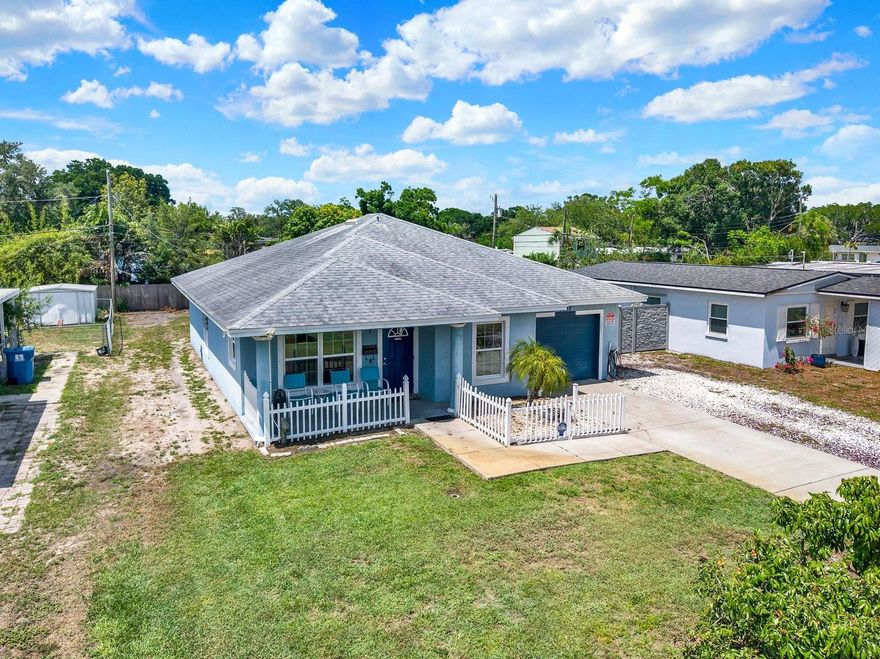 Welcome to this beautifully maintained 3-bedroom, 2-bathroom block home built in 2013, perfectly situated in a desirable St. Petersburg neighborhood. Enjoy a spacious lot not in a flood zone, with no flood insurance required. This home features fresh, no-carpet flooring and is tiled throughout for easy cleanup. Fresh interior paint brightens the space, while the eat-in kitchen has a charming picture window and a breakfast bar, perfect for casual dining. Enjoy the convenience of an indoor laundry room and a deep one-car garage for extra storage. The covered front porch overlooks a mature lychee tree in the front yard. The backyard offers a fruitful mango tree and lush landscaping, creating your own private oasis. Enjoy a prime location just 10 minutes from Downtown St. Pete and Central Avenue. Located in a quiet, established neighborhood, this home offers easy access to local amenities and is 15 minutes from the beach! Schedule your showing today.