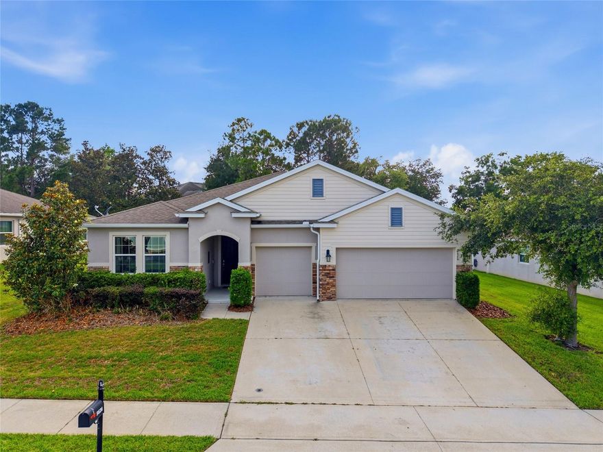 This one checks all the boxes.  Located in the gated community of Meadows at Heath Brook, this 4br/3.5ba DR Horton Camden model offers over 2,800 living sq ft, a 3-car garage, and two bonus/flex spaces for the lifestyle you want.  The open layout feels bright and spacious with tall ceilings, tray ceiling details, and a stylish kitchen featuring granite countertops, island seating, pendant lighting, pantry and newer stainless-steel appliances. The split-bedroom design gives the primary suite extra privacy, complete with LVP flooring, walk-in closet, dual sinks, garden tub, and separate shower.  Two bedrooms share a Jack and Jill bath, while the fourth bedroom has its own bath, walk in closet and bonus room nearby, ideal for guests, work from home space or a creative set up.  Triple sliders lead to the covered screened porch and privacy fenced backyard, giving you the perfect spot to unwind or entertain.  Plus, there is an EV charger outlet, indoor laundry, mudroom, mounted Livingroom TV and gated community amenities, all just minutes from shopping, dining and easy access to SR 200 and I75