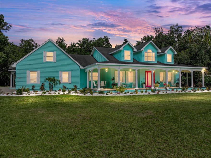 A private tropical retreat set on 1.96 carefully manicured acres, this 5 bedroom, 4 bathroom
pool home offers the ultimate in flexibility, privacy, and style, including a full 1 bedroom in-law
suite with its own kitchen, living room, private entry, and pool access. Behind the gated entry, a
long driveway leads you through lush Florida landscaping to the classic covered front porch, a
warm and inviting welcome to this spacious 4,242 sq ft estate. Inside, you're greeted by a
dramatic two-story foyer featuring decorative tile work and elegant stair railings. The main
living areas are open and thoughtfully designed, with architectural archways, crown molding,
built-in speakers, and elevated lighting fixtures throughout. French doors in the generous living
room lead to the screened lanai, and the space offers clear views of the pristine eat-in kitchen,
complete with stunning wood cabinetry, granite countertops, stainless steel appliances, a
center island, and a cooktop accompanied by a custom range hood. Dining and entertaining
here is effortless, with a sunny eat-in dinette, breakfast bar seating, and a formal dining room
positioned near the front of the home. The first floor hosts two bedrooms and two full
bathrooms, including a spacious guest bedroom with access to a full Jack-and-Jill bathroom,
as well as an oversized peaceful primary suite offering pool views, private lanai access, a
massive walk-in closet with custom organizers, and a luxurious ensuite bath with dual sinks
and a custom walk-in shower featuring multiple showerheads, bench seating, and a glass
enclosure. Upstairs, the home continues to impress with two additional generously sized
bedrooms, a full guest bathroom, and a dedicated storage room for added functionality. The

private in-law suite enhances the home's versatility- perfect for multigenerational living, long-
term guests, or rental income opportunities. This self-contained space includes a full kitchen,

living area, bedroom, full bathroom with direct pool access, and three private entrances: one
through the garage, one from a separate covered front porch, and one from the pool deck. Its
own dedicated laundry setup in the garage adds even more independence. Step outside to a
massive screened pool deck finished in pavers and bordered by tranquil wooded views. Two
storage sheds sit neatly on the property, and the welcomed shade from mature trees makes
outdoor living as comfortable as it is scenic. With an additional 1,823 sq ft of open porch
space, there's no shortage of spots to relax and enjoy the meticulously maintained landscape.
This is a truly special opportunity to own a sprawling estate in the heart of Zephyrhills. Contact
us today to schedule your private tour.