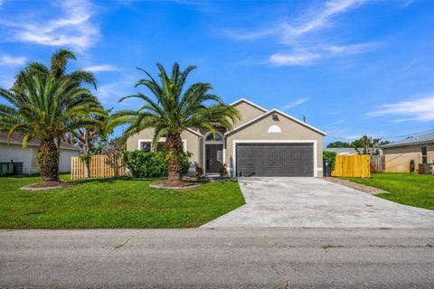Photo of 2050 SW Libra Lane, Port Saint Lucie, FL 34984 (MLS # O6403414)