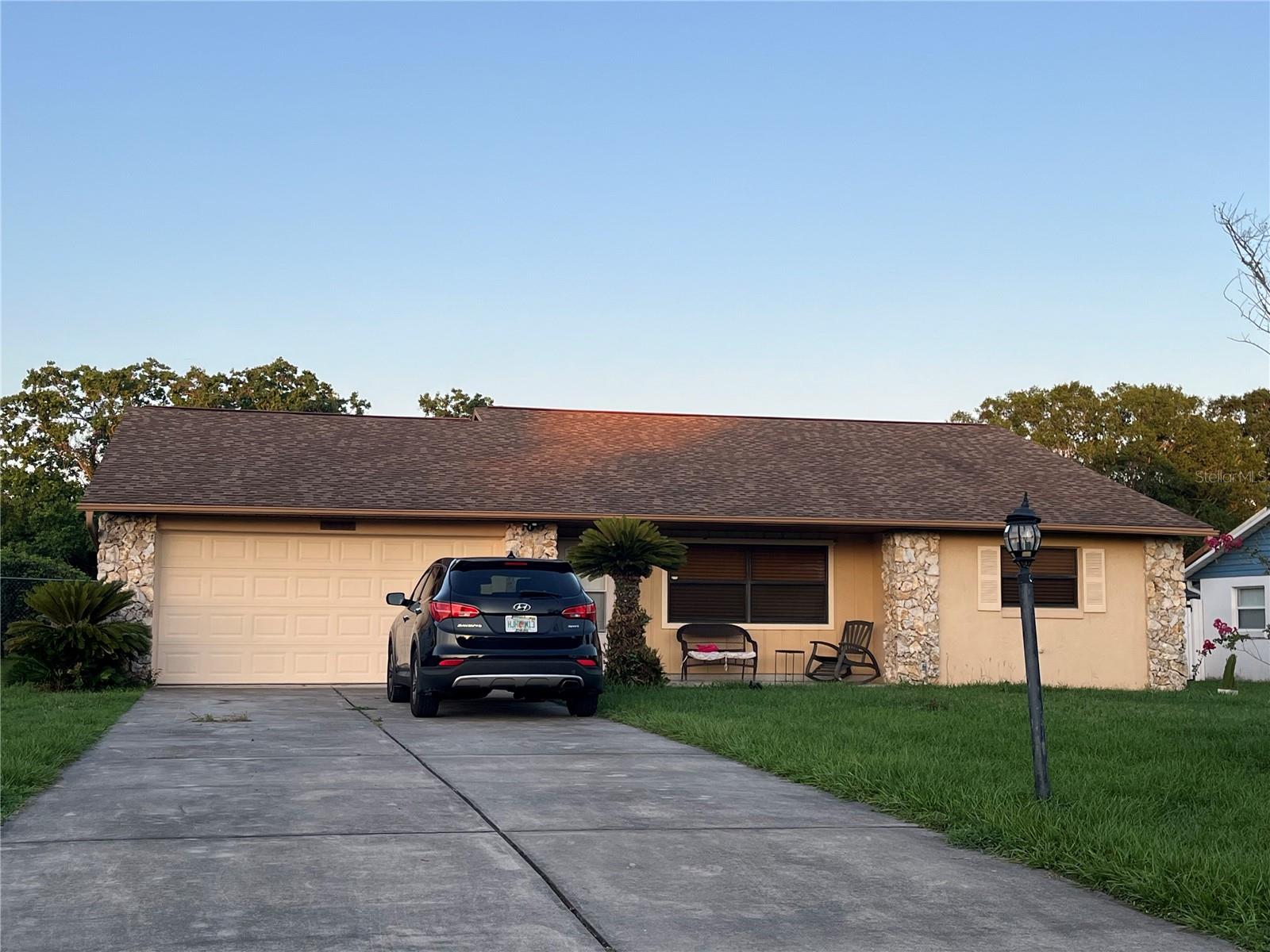 STOP RIGHT THERE! You've found your home. This lovely 3 bedroom 2 bath ranch style home boasts over 1,700 square feet of spacious living area and a beautiful fenced backyard that backs up to a lush green pasture where the local horse neighbors visit daily. Freshly painted inside, ceramic tile and carpet throughout and a neutral canvas allows you to create your own designs in this amazing place. Recent updates include a tankless hot water heater and new electrical panel w/in the last 2 years; HVAC system and blown-in attic insulation w/in the last 3 years; washer & dryer w/in the last 5 years; and the septic system pumped the last 60 days to allow for peace of mind. This incredible property is situated in one of Belleview's most desirable and well established communities. Conveniently located between Ocala and The Villages makes commuting a breeze, not to mention the close proximity of all the amenities Marion county has to offer. Hurry look no further, schedule your private showing today!