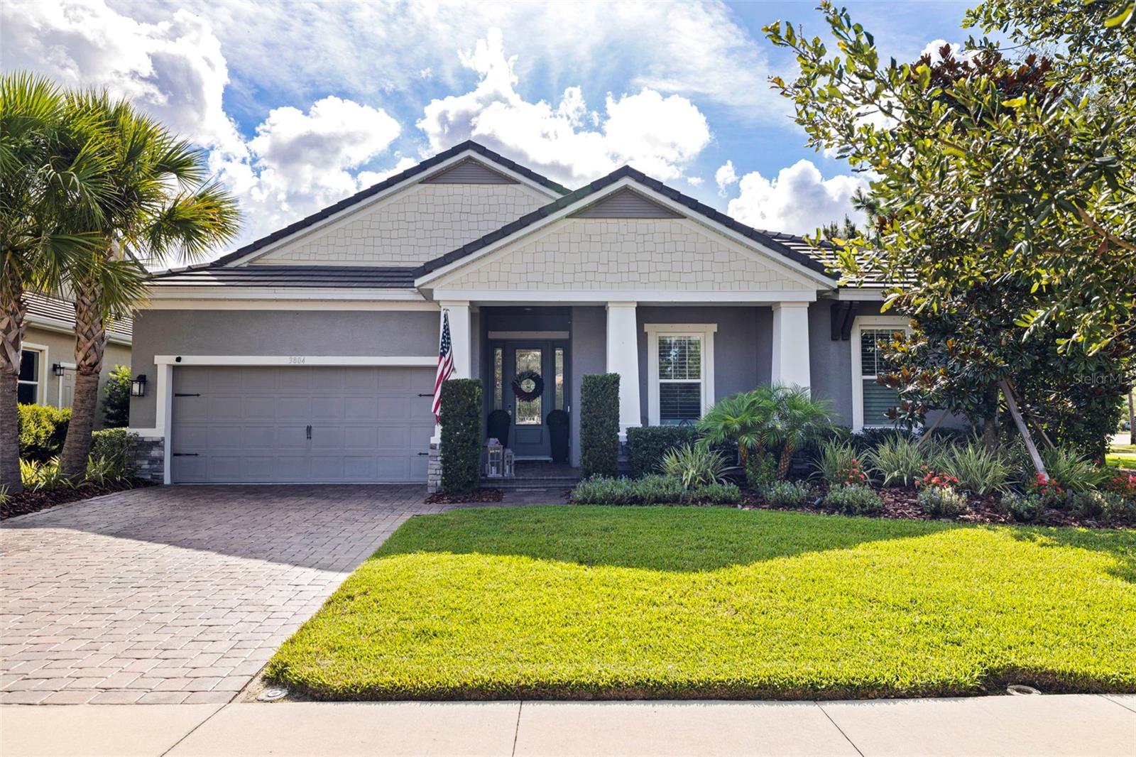 Nestled on a private corner lot in the award winning community of Starkey Ranch, this elegant home delivers quiet luxury, effortless functionality, and outdoor living at its finest. With 4 spacious bedrooms, a versatile den (optional 4th bedroom), 3.5 baths, and a 3-car tandem garage, this home was thoughtfully designed for both comfort and style. The open floor plan and kitchen showcases an oversized quartz island, stainless steel appliances, a gas range, tray ceilings, and designer finishes throughout. The generous primary suite includes a spa-inspired bathroom, with a walk-in glass shower, and an expansive walk-in closet offering direct access to the laundry room for added ease. Step outside to your personal tropical escape, featuring a sparkling resort-style pool with swim-up barstools, a screened lanai, lush landscaping, fire-pit, and a covered outdoor living area ideal for entertaining and enjoying the Florida lifestyle. Energy-efficient upgrades include solar panels and an EV plug-in garage. Curb appeal shines with freshly sealed pavers and updated landscaping, while the fully fenced backyard preserves sweeping conservation views for a perfect blend of privacy and nature. Starkey Ranch is Tampa Bay's premier master-planned community with over 22 miles of scenic trails, resort-style pools, dog parks, sports fields, playgrounds, gardens, and a top-rated K-8 school. With shopping, dining, and healthcare minutes away, and just 30 minutes to Tampa International Airport. This is a home offering the perfect lifestyle blend of luxury and convenience. Meticulously maintained and move-in ready. View the video walk through video and schedule your private showing today.
