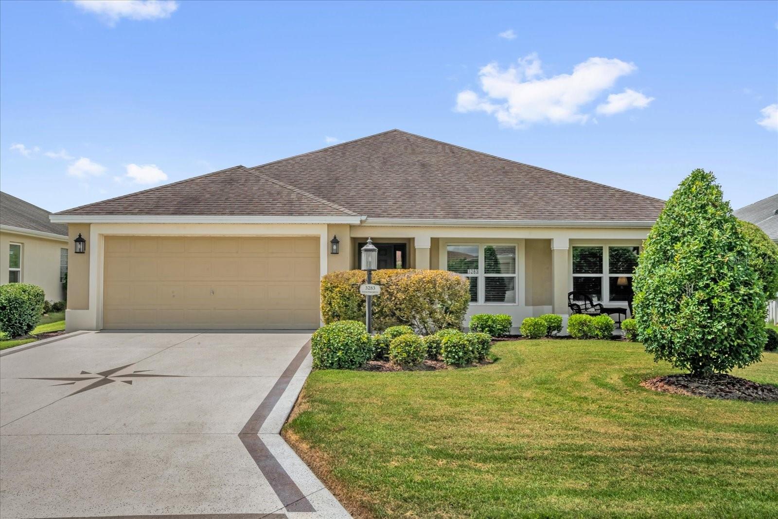 Welcome to this “priced-to-sell,” well-maintained Creekwood-5 Model Home located in the popular Village of Pine Ridge! Perfectly positioned between Brownwood Paddock Square and Lake Sumter Landing, you’ll enjoy convenient access to nightly entertainment, shopping, dining, golf, and recreation.
>Prime Location:
- Colony Plaza shopping & dining just ~1.4 miles away
- Moyer Recreation Center, Sarasota Golf Practice Center, and Executive Courses nearby
- Belle Glade Country Club & Championship Golf Course just down the street
- Neighborhood pool within minutes
> Spacious & Inviting Floor Plan:
This open, split design offers both comfort and function—perfect for everyday living and entertaining. The kitchen boasts a large island, matching backsplash, ample cabinet storage, canned lighting, and expansive counter space, plus two dining areas for flexibility.
The living room features a skylight for natural light, freshly painted walls, crown molding throughout, and luxury vinyl plank flooring (no carpet anywhere!).
> Outdoor Living at Its Best:
Expand your living space by opening the large sliding glass doors to a covered, screened-in lanai with a painted floor and upgraded dark screen for extra privacy. No kissing lanais here! The owner even planted two rows of privacy hedges, and with 220 wiring already in place, you’re ready to add a hot tub. Coolaroo blinds create a cozy, shaded retreat.
> Extra Features You’ll Love:
- Ceiling fans in every room
- Epoxy-coated garage floor
- Stained driveway, walkway, and front porch for curb appeal
- Charming full-length front porch—a perfect spot to relax and enjoy the neighborhood
- 2011 Yamaha gas golf cart INCLUDED
> Quick Close Opportunity:
This stucco home is available for an early, easy close with immediate possession. Bond balance: $21,049.11.