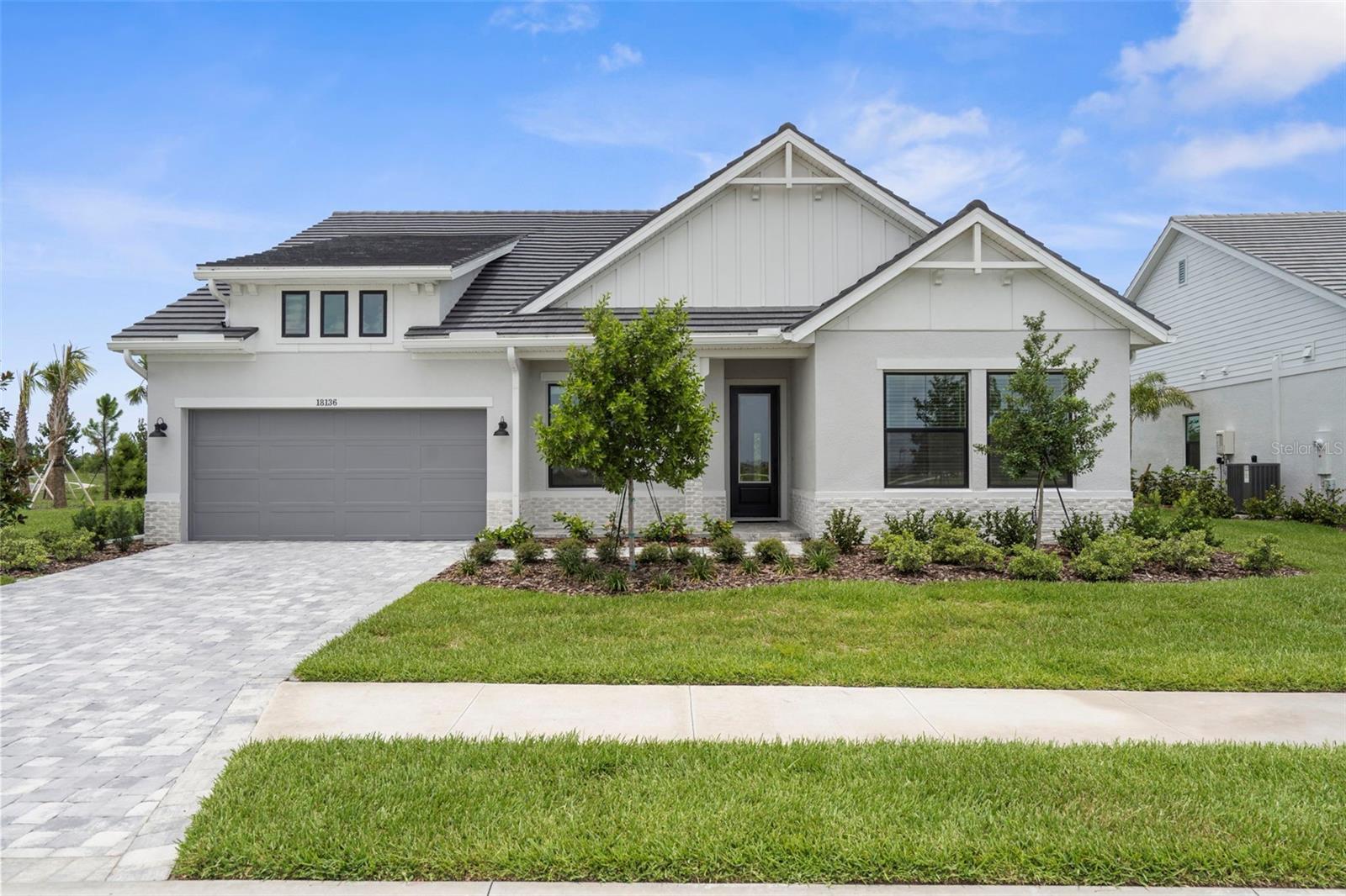 Quality craftsmanship in this newly-built masterpiece from award-winning David Weekley Homes. This 4BR, 3BA home with a 4 car tandem garage is situated on a premium corner lot, with lake and preserve views and an exceptionally private feel! No waiting . . . move right in and start living your best Florida life at the lowest price for this model in the community! A step beyond move-in-ready, finishes like custom ceiling fans in all bedrooms and washer/dryer have already been installed and the home has been beautifully furnished.
The open floor plan of the Colston model is designed for your lifestyle, with various spaces offering endless possibilities: gather with friends to watch sports or a movie in the specialty TV/Media Room, get some work done in the study, or grill and chill on the quiet lanai. There's even room to add a pool! This home features hurricane impact windows, a tankless water heater, quartz countertops in kitchen, baths and utility and ten-foot ceilings. Soaring 14-foot ceilings in the family room lend an airy feel, while large windows let in lots of natural light. A warm, neutral design palette is complemented by durable, water-resistant, planet-friendly RevWood flooring throughout, with tile in baths and laundry, and long-life carpet in the 4th bedroom.
The kitchen, overlooking the many gathering spaces, is the heart of the home, with a large island with breakfast bar, stainless steel appliances, wine fridge and abundant storage and prep space; a gas cooktop with upgraded designer hood and separate built-in oven and microwave. A large walk-in butler's pantry would make a great coffee station or bar with extra cabinets and shelves, completing the perfect kitchen package.
The luxurious Owner’s Retreat is complete with an enormous walk-in closet (18x8 feet!) and ensuite bath with a spectacular oversized Super Shower. Three additional bedrooms and two more full baths are located at the front of the home, ensuring privacy. The new Palmera community is situated to take maximum advantage of Downtown Wellen’s walkable shopping and dining plus endless nearby amenities (CoolToday Park, golf and country clubs, concert and event spaces, miles of trails and an activity lake). Or enjoy Gulf Coast living at local beaches and charming Historic Downtown Venice.
Get ready! Soon, you'll enjoy a resort-style pool, clubhouse with a lifestyle director, golf simulator, onsite pub/grill, fitness center, pickleball courts, fire pits, dog park and adventure playground! Plus, landscape, cable & internet are all included in HOA dues. This home is an exceptional blend of privacy, comfort and luxury in one of Wellen Park’s most sought-after neighborhoods. This isn't just a house, it's your next chapter. Schedule your exclusive tour to experience in person what sets this home apart.