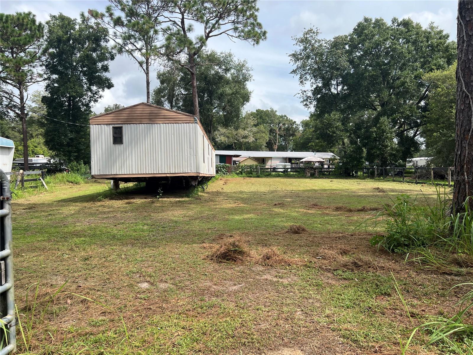 OWNER IS MOTIVATED TO SELL!!! This land offers an incredible opportunity for investors or to establish your primary residence. Located near the World Equestrian Center, Ocala International Airport, I-75, and of variety of shopping, dining, and entertainment opportunities. This property has an established address, electric service, and a well. The lot is clean and partially fenced. There is a mobile home on the property that needs to be remodeled or removed, depending on the buyer. Excellent opportunity!!!!! Don't miss it! Call today to schedule your viewing appointment!!!!!