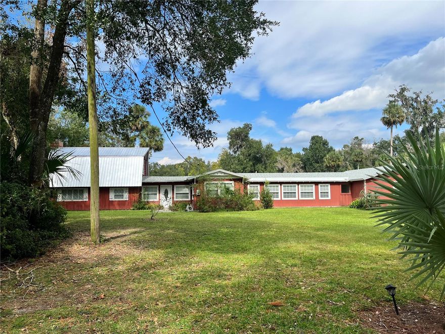 Enjoy this beautiful gated property in a country setting with all the conveniences of the city.  This property offers 6+ acres with mature landscape, stocked spring fed pond and fa guest suite with a fireplace and plenty of room for outdoor enthusiasts.  This immaculate home boasts a large kitchen with plenty of cabinets and beautiful built in wall to wall display cabinets.  Sliding glass doors open to the screened patio overlooking the pond. The gorgeous wood floors are original to the home.  The 3 car garage offers plenty of room for toys and vehicles.  the 2 out buildings are ideal for a workshop and a she shed.  This property is close to the 429, Wekiva State Park and the heart of central Florida.  Come enjoy the country life!