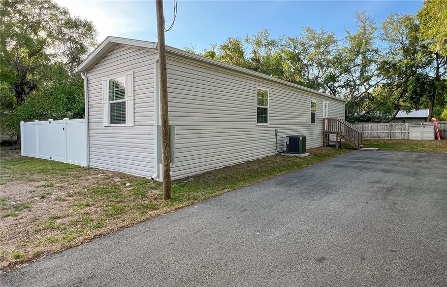 Don’t overlook this almost-new, turnkey home. Why settle for a fixer-upper when you can move right into this 2024-built, 3-bedroom, 2-bath single-wide manufactured home on its own lot? The bright, open kitchen features white cabinetry, stylish countertops, stainless steel appliances, a range hood vent, and ample cabinet space. Luxury vinyl plank flooring flows through the main living areas, complemented by modern fixtures, added ceiling fans, and tasteful finishes throughout. The open-concept design offers a desirable split-bedroom floor plan for added privacy.</p><br >Outside, enjoy the convenience of an asphalt driveway and a partially fenced yard ideal for pets, play, or relaxing outdoors—with plenty of room for your boat, RV, or other toys. Located in Moon Lake Estates, the property offers the benefit of no HOA, is not in a flood zone, and is just minutes from Moon Lake Park, shopping, dining, and convenient access to Suncoast Parkway and surrounding areas.</p><br >Built in 2024, this home also offers the peace of mind and efficiency that come with newer construction, including newer appliances, systems, and components—helping reduce the maintenance concerns often associated with older homes.