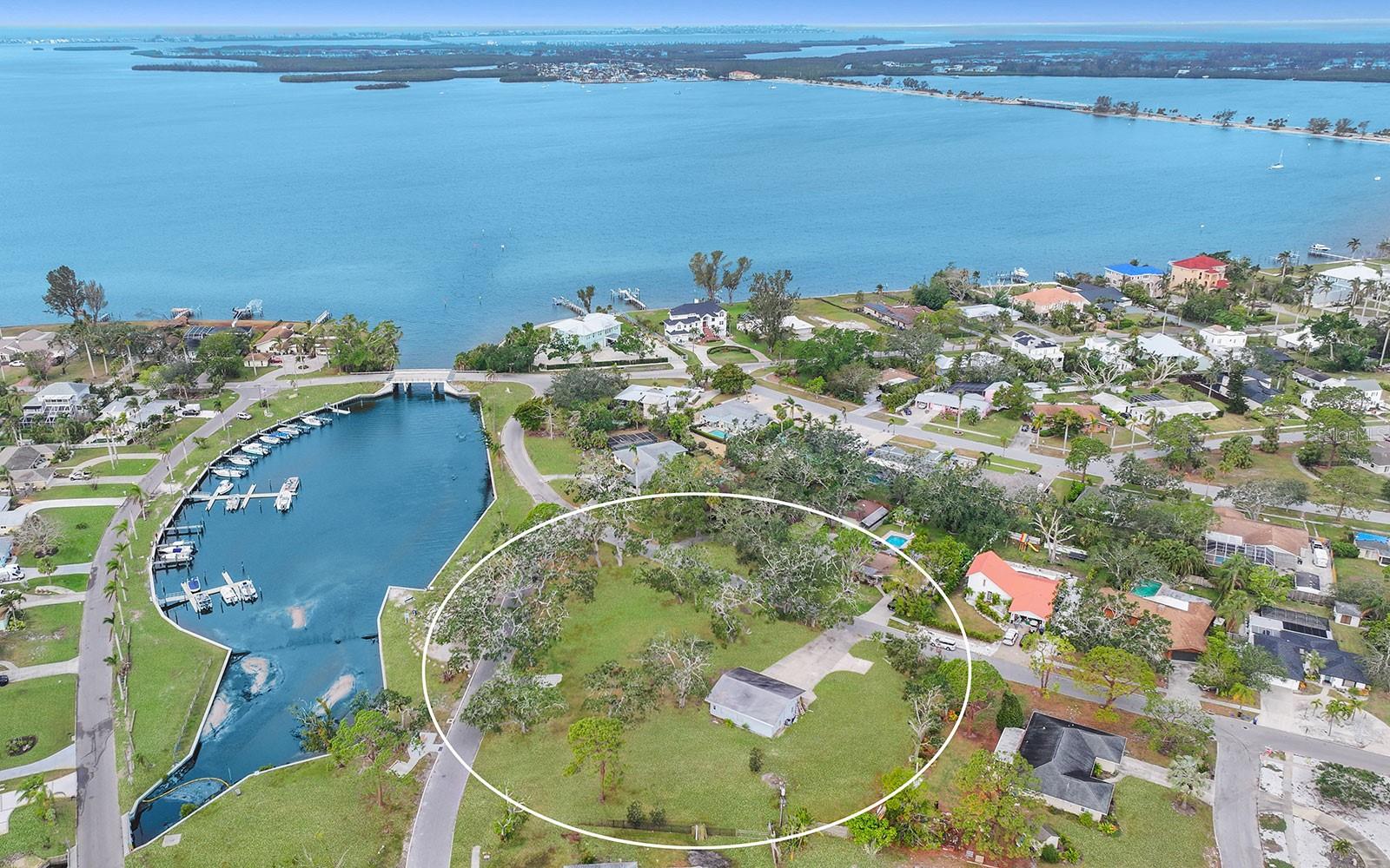 1.2 acre corner lot subdividable into multiple parcels, providing flexibility for development in a highly-desirable waterfront community. Rare oppportunity to shape your vision on this expansive land parcel positioned adjacent to the Palma Sola Park boat basin. With the flexibility to subdivide into several parcels, this is a prime opportunity to build in one of Bradenton's most sought-after and scenic communities. This fabulous property sits high and dry and had no water from the recent storms. Palma Sola Park is one of Bradenton’s oldest neighborhoods with winding roads and six small parks creating a feeling of openness and spaciousness. This property is directly across from Portosueno Park with frontage on Alcazar Drive and Portosueno Avenue. The northwest Bradenton location is highly desirable because it is situated on the water between Manatee and Cortez avenues, both of which lead to Anna Maria Island beaches. Nearby amenities include shopping, dining, medical, top-rated public and private schools, marinas, and a variety of county parks. Anna Maria Island and Downtown Bradenton are within 10-minute drives to the west and east. Please note that acreage is approximate.