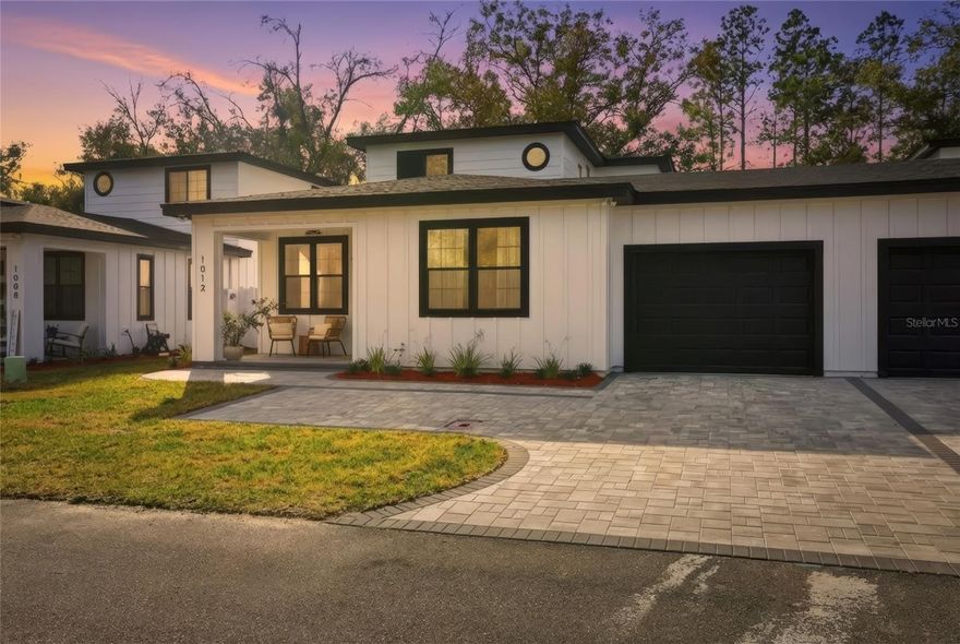 2026 Parade of Homes Winner! First Place Single Family Home & Judge’s Choice for Best Use of Space. Welcome to 1012 Farmstead Street, located in Farmstead 44, a boutique low-maintenance community in Eustis just 10 minutes from historic downtown Mount Dora, waterfront parks, dining, festivals, and shopping, with convenient access to US-441. This brand new 4 bedroom, 2.5 bath home offers 2,055 square feet of award-winning design. Homes are connected only at the garage for ample privacy. Your home features quartz countertops throughout, 42-inch kitchen cabinetry, engineered hardwood flooring, and a full LG appliance package included. The first-floor primary suite opens to a private screened patio, creating a quiet retreat. A fully fenced yard with paver courtyard offers additional outdoor living space ideal for entertaining or pets. Don’t miss the under stair pet nook for your furry friends! Upstairs bedrooms can all comfortably accommodate king beds, with custom closet buildouts, and flexible space for guests, office use, or hobbies. Foam insulation throughout and concrete block construction on the first floor provide added efficiency and durability. The monthly $190/mo HOA includes lawn care, landscaping, and irrigation, for a low-maintenance lifestyle. Move-in ready and professionally recognized for its design, this home offers a rare opportunity to own an award-winning property near Mount Dora!