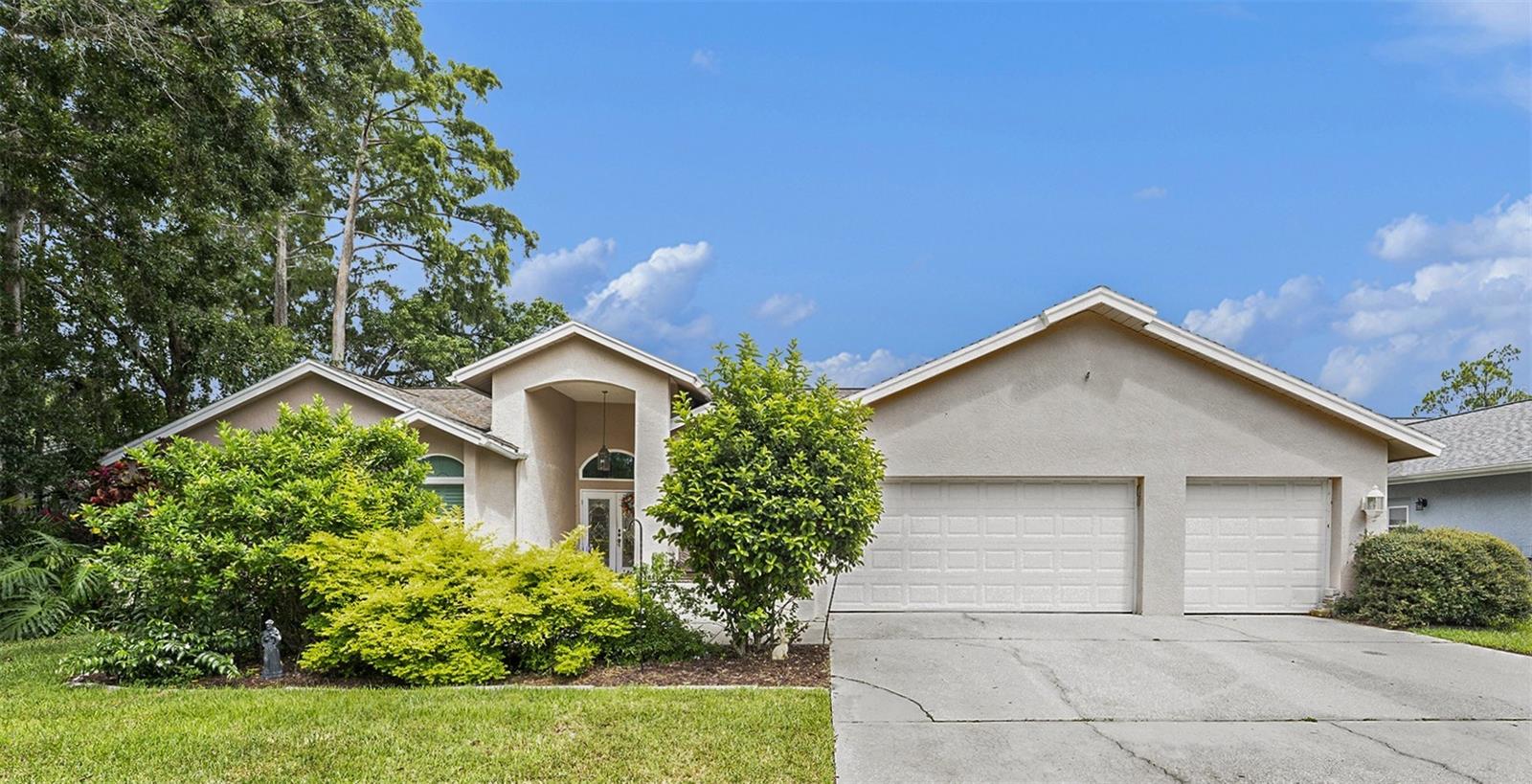 Welcome to this stunning 4-bedroom 3.5-bath home with an OFFICE, located in Palm Harbor’s East Lake Corridor in the highly sought-after gated community of Briarwick. This home checks all the boxes, offering almost 3,300 sq ft of living space, a private SALTWATER HEATED pool, and a 3-car garage, this home delivers the perfect blend of comfort and Florida living. Step through the foyer entry with coat closet into a light and bright interior featuring soaring vaulted ceilings and stylish wood flooring throughout. The split floor plan offers privacy and function, while the open layout connects the spacious living areas seamlessly. The heart of the home is the large kitchen, boasting TONS of cabinetry, a French door stainless steel fridge, built-in organization, a chalk wall, and sliding windows that open directly to the pool area. The kitchen flows into the living room with a wood-burning fireplace, ceiling fan, and high ceilings - perfect for gathering and entertaining. Retreat to the expansive primary suite, complete with private French doors to the pool, a walk-in closet, and a large bathroom with soaking tub, walk-in shower, long vanity, and separate water closet. The additional bedrooms are generously sized with ceiling fans and share a double-sink bath. A third updated bathroom features modern tile, fixtures, and finishes. Enjoy year-round outdoor living in your private backyard oasis, featuring tropical landscaping, a screened-in pool, a covered patio dining area, and a fenced yard ideal for gardening or pets. Located just outside a shopping plaza with Publix and Starbucks, and near the YMCA, Lansbrook Golf Club, top-rated schools, and a short drive to the Gulf beaches - this home offers both luxury and convenience in one of Palm Harbor’s most desirable neighborhoods.