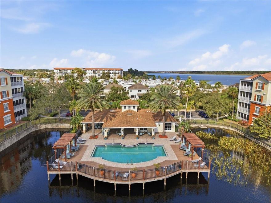 DON’T MISS THIS FABULOUS WATERFRONT CONDO IN SEMINOLE! Enjoy spectacular sunrise water views from this beautifully maintained, and updated 3BR/2BA + bonus room/office area in the MONTEREY AT LAKE SEMINOLE community! This GATED boutique community feels intimate with only 3 buildings that surround its beautiful fountain, resort style pool and clubhouse w/fitness center.  This particular unit is very special.  It was the model condo for Pulte (builder) during initial sales. It's location in the community is prime (overlooking the lake, south side CORNER UNIT) The open and flowing floor plan of this condo lives more like a home sweet home, than a "rectangle box" condo, and features high ceilings, new Hurricane rated windows, updated AC, hot water heater, plenty of natural light and serene lakefront views from almost every window.  You will enjoy the elevated coastal and modern vibe of this unit! And its 2000+ square feet of living allow for so many different areas to enjoy. The gourmet kitchen boasts wood cabinetry, solid surface countertops, and a breakfast bar, and pantry. The primary suite offers stunning water views, a large walk-in closet, and a beautifully renovated en-suite bathroom. The luxurious en-suite bath features a uniquely designed shower and dual vanities. A versatile BONUS ROOM by the front door would make a great home office or guest space. Additional highlights include an IN-UNIT full LAUNDRY ROOM (with lintless Dryer that does not need the biannual clean duct clean out required by the HOA), private screened in balcony, storage closet and a deeded carport. The owners have taken good care of this property, and it shows! Relax on your east-facing balcony and take in breathtaking sunrises over the lake or go for a dip in the pool or a do a workout in the top-notch fitness center. Pool patio also offers grills and plenty of tables for your get togethers.  Monterey is a non-age-restricted, PET-FRIENDLY community with resort-style amenities—clubhouse, fitness center, heated pool, private fishing dock. Prime location minutes from Lake Seminole Park, award-winning Gulf beaches, lots of shopping and dining at Seminole City Center, dining, and top-rated schools. Schedule your private tour today!