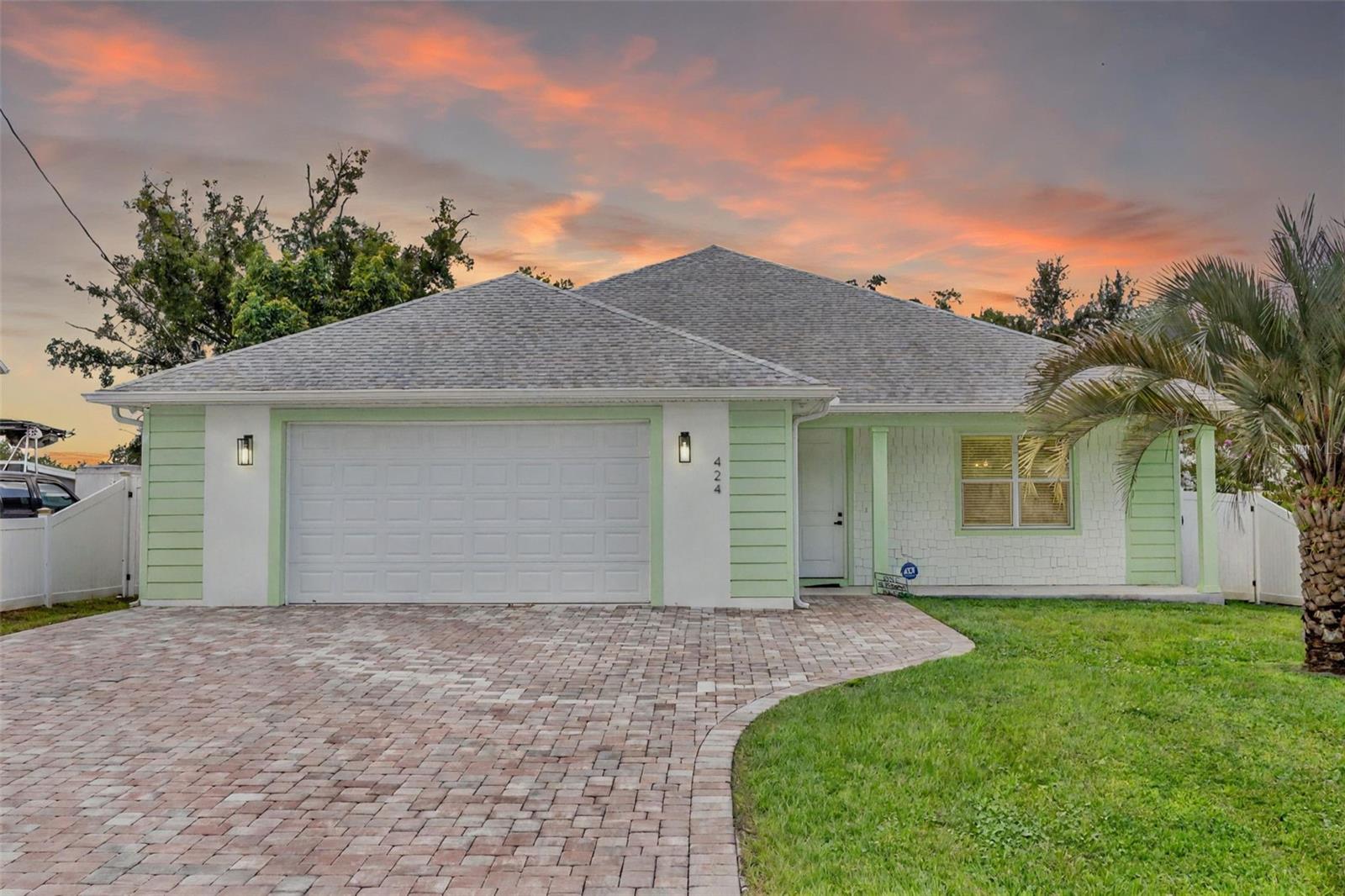 One or more photo(s) has been virtually staged. Experience the versatility of true multigenerational living in this well-maintained 2023 build, thoughtfully designed as two separate residences under one roof. With private entrances in both the front and back, plus a shared oversized garage with individual hallway entries, this home offers the perfect balance of connection and privacy for extended family, guests, or rental opportunities.
The main residence features an open-concept floor plan with a combined living room, family room, and kitchen. Upgrades include stainless steel appliances, granite countertops, and Aristokraft cabinetry. Two spacious bedrooms and a spa-inspired bathroom with an oversized walk-in shower and designer tile make this space stylish and functional.
The attached private suite is connected by the garage hallway but remains completely independent, featuring its own entrance, a cozy living area, 1 bedroom, 1 luxurious bathroom with an oversized designer-tile shower, and a kitchenette—ideal for in-laws, guests, or rental income.
Every room throughout both residences has its own split A/C unit for individualized comfort.
Outdoor living shines with a .19-acre fully fenced yard complete with Papaya fruit trees, a paver driveway, and ample space for entertaining, pets, or play. With 2,004 heated square feet, modern finishes, and NO HOA, this property offers flexibility, comfort, and freedom—conveniently located near major roadways including the 528 Beachline, 417, and Orlando International Airport.