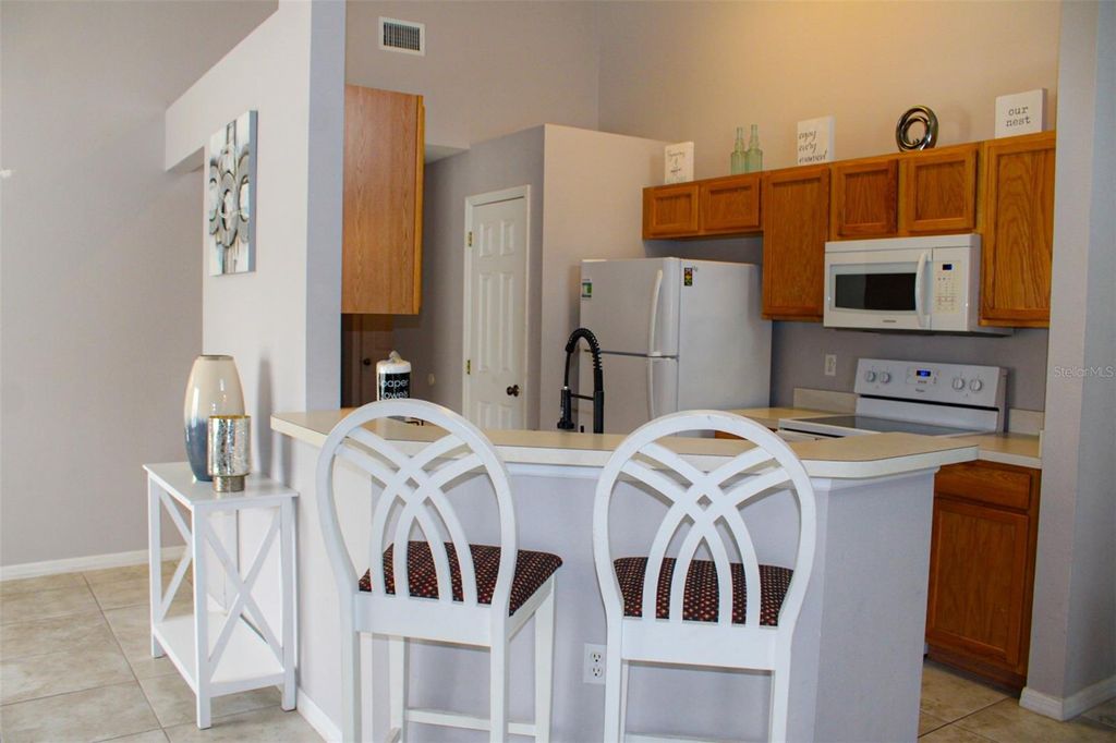 Photo of 108 Grosvenor Loop, Davenport, FL 33897 (MLS # O6408626)