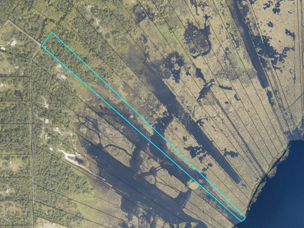 Escape to wide-open skies and peaceful lakefront surroundings on this rare 15-acre lot on Lake Harney. Perfect for those who value space, privacy, and natural beauty, this property is a blank slate for your dream home. Don't wait, Claim your piece of paradise today!