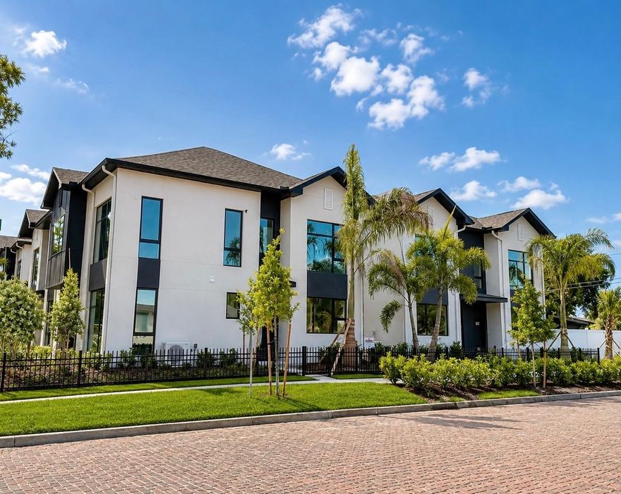 One or more photo(s) has been virtually staged. NEARING COMPLETION — come tour now! Intentional spaces. Curated design. Dramatic ceilings. Expansive windows. Contemporary architecture meets effortless St. Pete living at Junction Townhomes — a boutique collection of only ten residences in the heart of Central Oak. One of only five homes released in Phase 1, this residence is the ONLY Harmony floor plan in the community. The bold Metropolitan Essence interior palette blends matte black finishes, rich contrasts, and refined textures for a sophisticated modern feel. Upstairs, the primary suite features a walk-in closet and spa-inspired bath. The sleek designer kitchen showcases European-style cabinetry, quartz countertops, LG stainless steel appliances and a dramatic waterfall peninsula that anchors the space with clean architectural style. Built with CMU block construction in a NON-FLOOD zone and ideally located just minutes from Downtown St. Pete, Grand Central, the beaches, and on the SunRunner line. Low maintenance living, easy insurability, 2-10 warranty. Buyers are responsible for verifying all information to their satisfaction, schedule your private showing today!