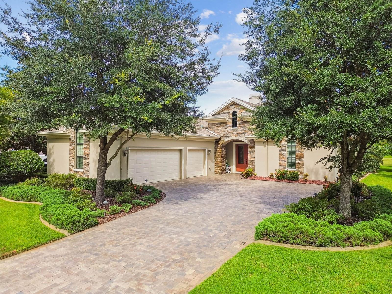 Welcome to the exclusive gated community of Wentworth, where luxury living meets timeless elegance. This Yorkshire model, crafted by premier builder Deeb, offers 3,152 square feet of thoughtfully designed living space with 4 bedrooms + BONUS ROOM and 3 full bathrooms.
Inside, refined details set the tone, including plantation shutters, crown molding, tray ceilings in the living room and primary suite, a large primary suite closet with a custom cabinetry and a island, and custom built-ins in all closets. A versatile bonus room offers the perfect space for a private office, media room, or den. The gourmet kitchen features a gas range, under-cabinet lighting, and new stainless steel appliances (2024), including a refrigerator, dishwasher, and microwave. A stone gas fireplace adds warmth and charm, while energy-efficient Low-E insulated windows and doors enhance comfort throughout the home.
Recent exterior updates include new lighting, fresh landscaping with decorative curbing, a 2024 irrigation well, a water softener (2023), a reverse osmosis system, and a new air conditioning system (2025). Outdoor living is a highlight, featuring a sparkling pool, expansive lanai, and a three-car garage that offers ample storage for vehicles and golf carts. Wentworth residents enjoy 24-hour security, a clubhouse with dining, and a lifestyle designed for both relaxation and recreation. This home combines timeless design, modern upgrades, and resort-style amenities in one of Tampa Bay’s most desirable gated communities. FLOOD ZONE X and EVACUATION D
