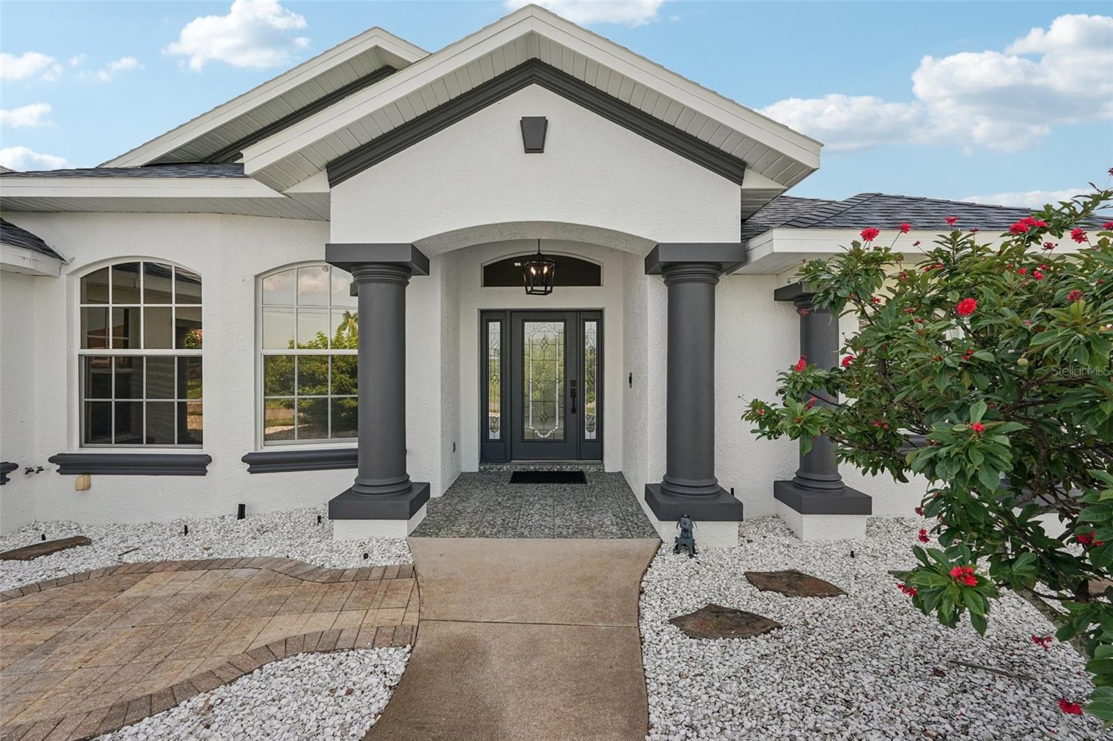 Welcome Home! This magnificent 3-bedroom / 2-bathroom pool home is waiting for you! There is also a den that leads to a bonus storage area. The home sits on an oversized lot of 13,812 square feet. From the moment you walk in you will be impressed with the soaring ceilings. The large owner's suite is big enough for a sitting area and has sliders out to the expansive brick paver caged pool area. Enjoy the spa-like primary bathroom retreat with double sinks, large shower, and water closet. New modern toilets were installed in both bathrooms. The chef is sure to appreciate the large kitchen with new Samsung stainless-steel appliances, granite counters, wood cabinetry, and a beautiful backsplash. Have confidence knowing the roof is only 1.5 years old. There is a great view of the pool area from the wall of sliders in the great room that wrap around the corner into the dining area. The Pool has been resurfaced, and a new variable speed pump was installed. The homes interior and exterior were recently painted, and travertine tile maintains fluidity and easy maintenance throughout the home. New Hunter ceiling fans were installed in the home and on the lanai. The 2.5 car garage is perfect for those extra toys. The property has a shed for added storage space. Fully furnished and ready for snowbird season! With an acceptable offer the owner will leave the fabulous new furniture making your move much easier. Start enjoying the Florida lifestyle! Call now for a private showing!!!