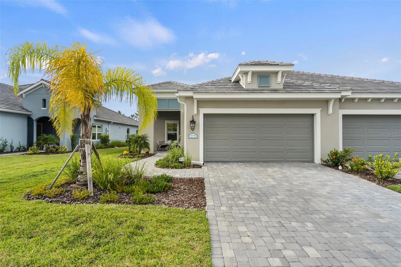 Location, Lifestyle, and Luxury in this 2-year-old villa! Immaculate, Open-Concept design with 3 bedrooms, 2 bathrooms, PLUS a Den/Office, and extended outdoor lanai offers plenty of space. Split bedroom design, pocket-slider glass door, stainless steel GE Appliance package, and quartz countertops are just a few of the upgraded features in this home. IMPACT Windows and Doors so no need to mess with hurricane shutters. This villa has no carpet- all tile and LVP flooring along with beautiful, custom accent walls in each of the bedrooms and den to make this a truly standout home.
Grand Palm is more than just a neighborhood; it's a community with so much to offer! From the Social Club to lounging by one of the 3 pools, 2 spas, Fitness Center, or Dog Park; you're sure to find something that fits your lifestyle. There are all kinds of sports courts (yes to Pickleball!), playground, splash pad, fishing docks, and miles upon miles of walking trails. Food trucks and monthly social calendar are a few extra perks. Grand Palm is part of Wellen Park, close to downtown and a short drive to Venice or Nokomis Beach. Come and experience for yourself the beauty of this home within this unique, amenity rich gated community!