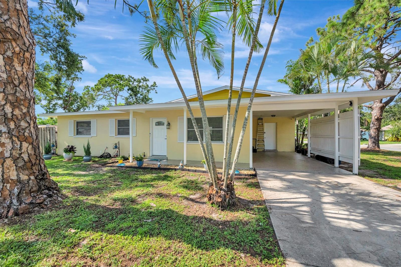 Welcome to this charming Sarasota home on a spacious .22-acre corner lot just off Bee Ridge Rd—offering comfort, convenience, and no HOA or CDD fees! Located in preferred flood zone X and within an A-rated school district, this well-maintained property features a bright Florida room under air with luxury vinyl flooring and walls of windows that fill the space with natural light. Just off the Florida room, you'll find a new screened lanai (completely rebuilt and permitted in 2022), perfect for outdoor relaxation. The home offers an open-concept living and dining area that connects seamlessly to a kitchen with granite countertops, a Whirlpool dishwasher (2024), and refrigerator (2023). Both bathrooms have been stylishly updated with new vanities, lighting, and tiled walls. Main living areas boast horizontal ceramic tile flooring, while bedrooms and the Florida room feature low-maintenance luxury vinyl. Enjoy a large backyard with endless potential, plus added perks like a carport with epoxy, inviting covered front porch, corner screened lanai, and a separate utility room with access from the kitchen or carport. Close to shopping, dining, golf, and more—this Sarasota gem is move-in ready and full of value!