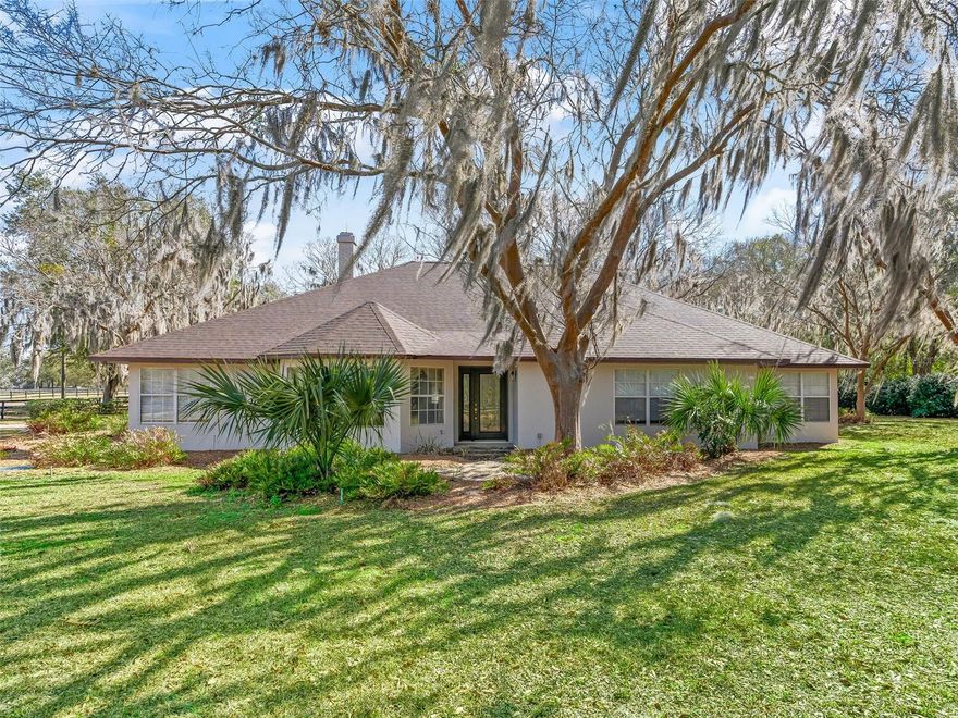 Excellent condition & location describes this house on an 3 acre corner lot within hacking & golf cart distance to the World Equestrian Center Ocala, yet located in a quiet horse friendly neighborhood with no HOA. The property has gorgeous oak trees, is level, & well designed to be able to accommodate a barn, arena & paddocks. The existing 3 bedroom plus office home is concrete block construction, has an attached 2 car garage, & is move-in ready with recently replaced roof, soffits, fascia, electric service, HVAC, hot water heater, & the exterior has been re-painted. The house interior has a generously sized kitchen with granite countertops, pantry & tile flooring. The over-sized primary bedroom opens to the Florida room & has an en-suite 5-piece bathroom with dual walk-in closet. Surrounded by gorgeous horse farms, but close to shopping, restaurants & amenities- this property is a must see!