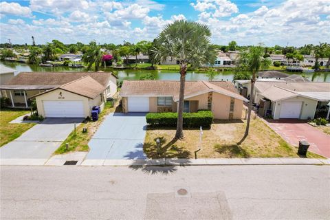 Photo of 2406 Society Drive, Holiday, FL 34691 (MLS # TB8499606)