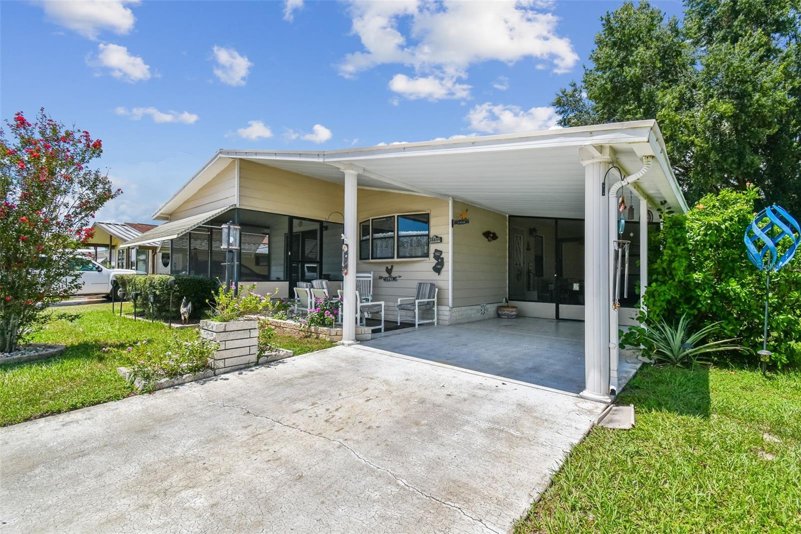 Own the land and a beautiful 2 bedroom 2 bath home in Colony Hills one of Zephyrhills premiere manufactured home parks!
The community boasts of many activities, a clubhouse with game room and billiards, pool, hot tub, tennis courts, pickle ball courts, shuffleboard courts, bocci ball court, putting green and horseshoe pits.
The well-lit curb and gutter streets are wide and all the lots are spacious.
The home has been well maintained and has a carport, workshop and indoor laundry room. It has two screened covered lanais and an open porch.
Inside it is a very large kitchen with updated cabinets, a dining area and a huge living room.
The primary bedroom includes a large bathroom with double sinks a shower and a water closet.
The second bedroom is ample and the second bathroom has a tub shower combination.
This community has no CDD fees and the homeowner’s association dues are only $600 yearly.
It is located within a two mile drive to Wesley Chapel and all it has to do including restaurants, shopping malls, movie theaters and entertainment.